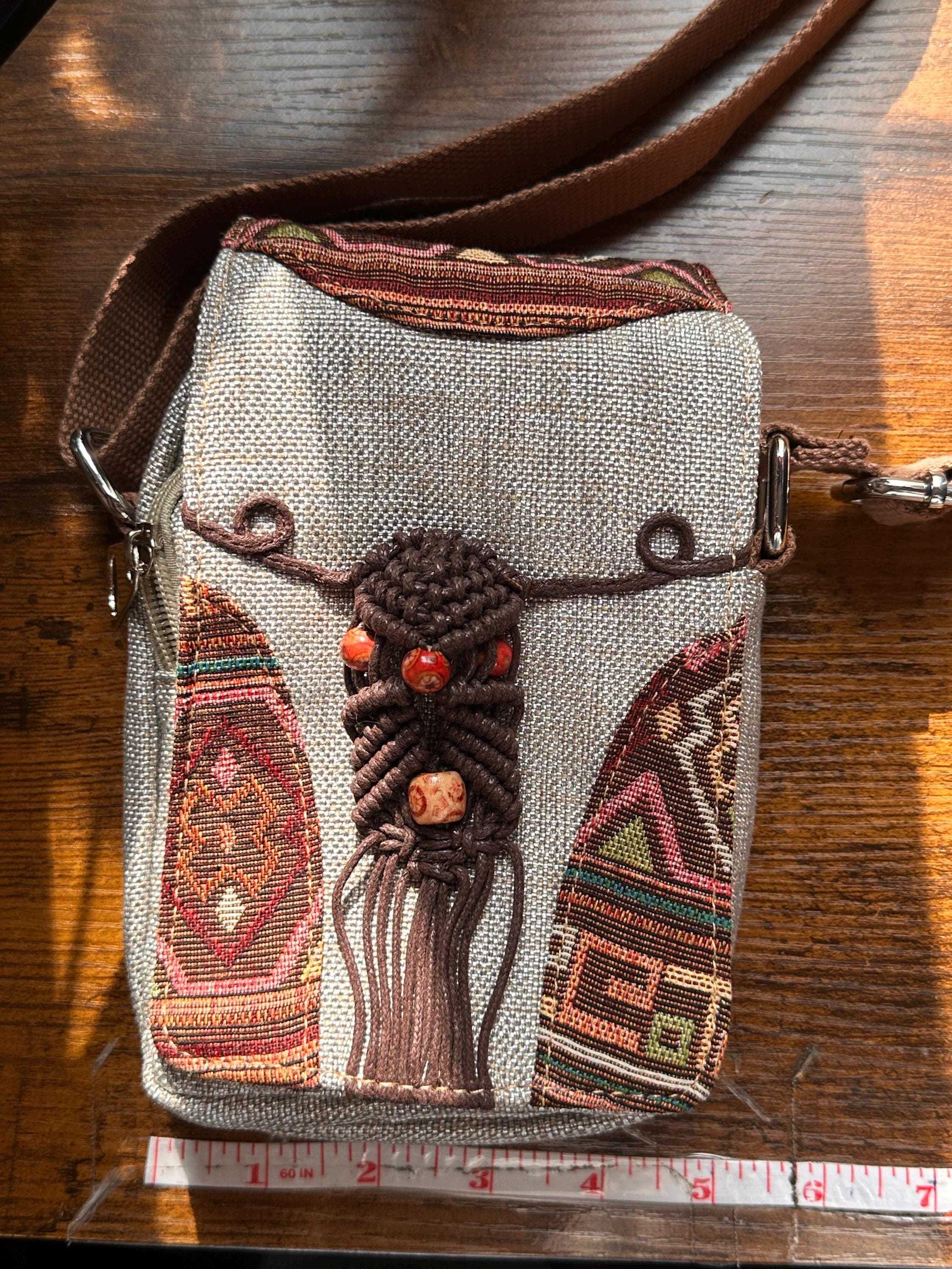 Close-up of woven fabric and decorative details of boho crossbody bag