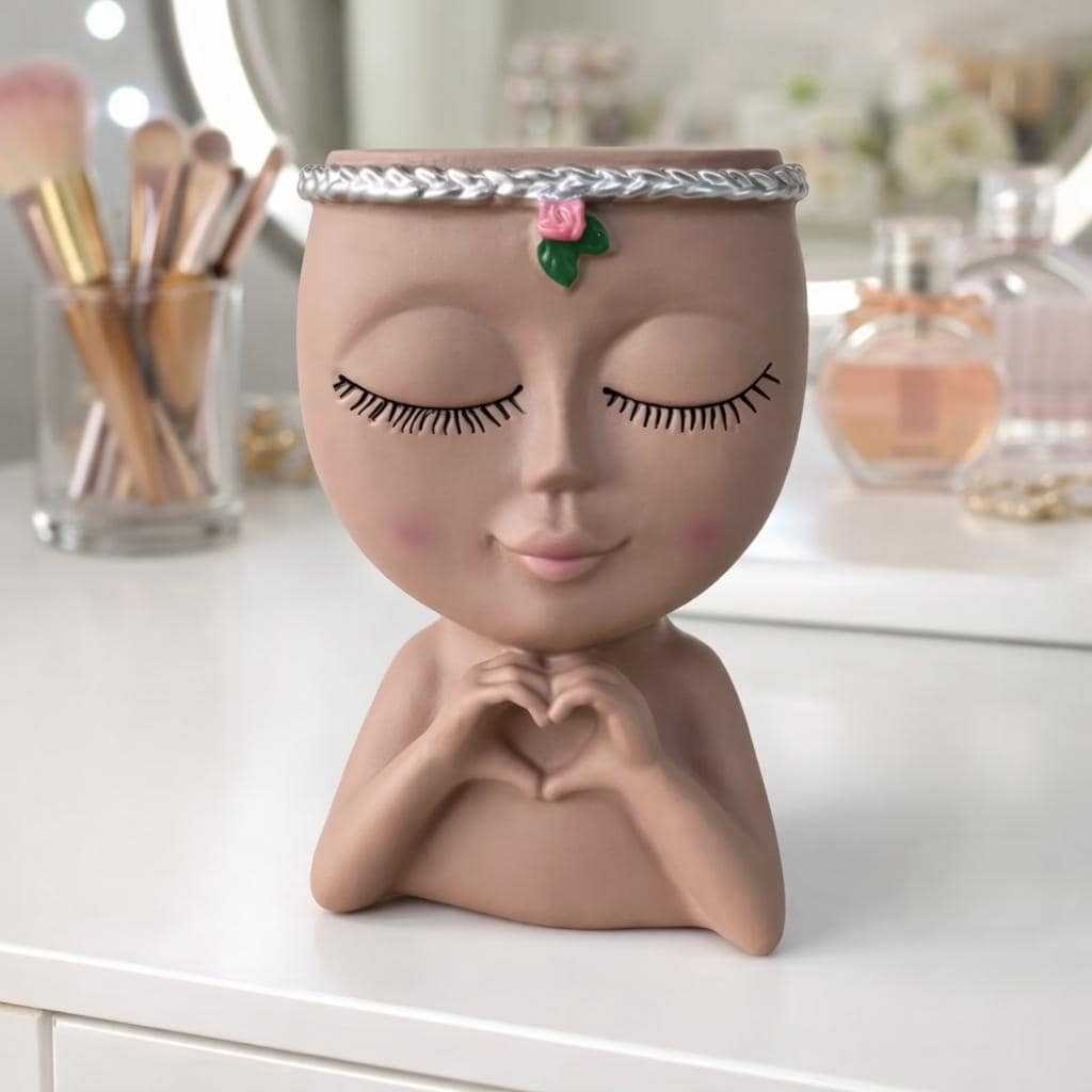 Decorative makeup brush holder featuring a modern face planter design for vanity organization and home décor