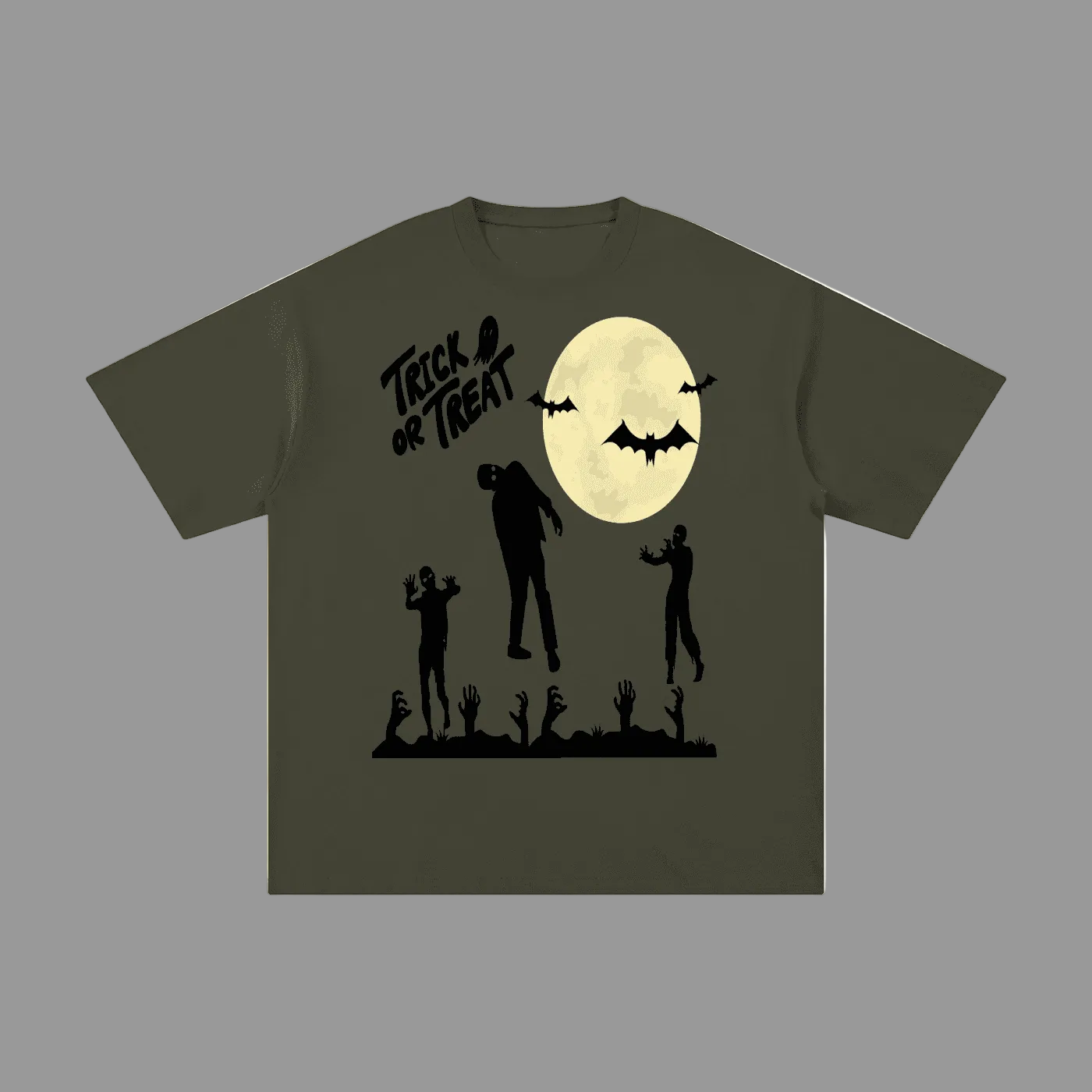 An olive green short-sleeve t-shirt with a black graphic print of a full moon, bats, zombies, and the text 'Trick or Treat' on a plain gray background.