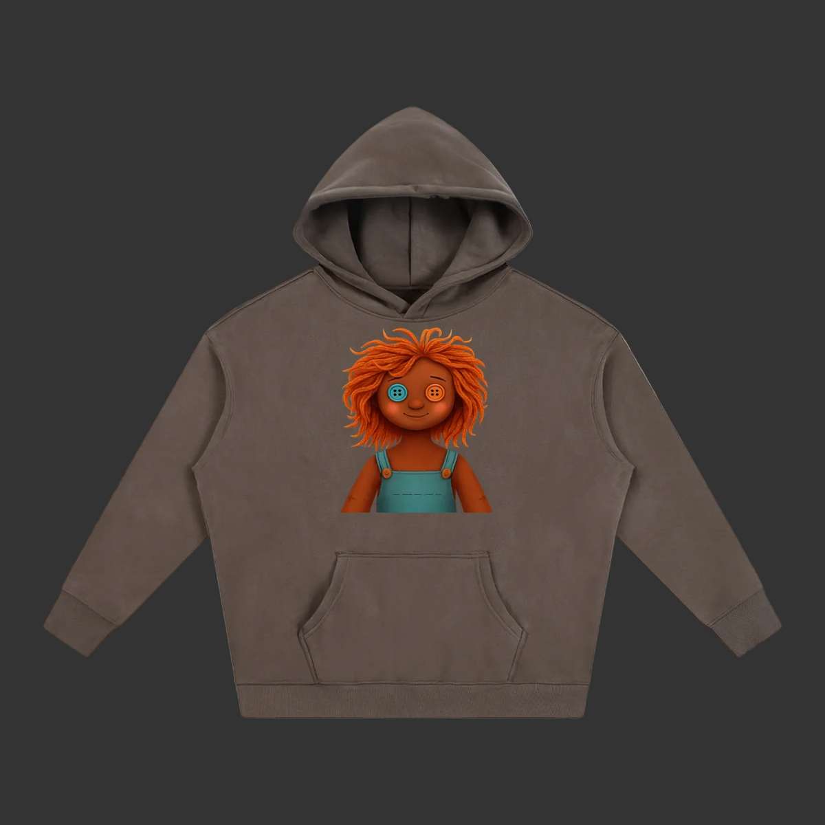 A dark brown pullover hoodie with a graphic print of a doll with orange hair and blue overalls on the chest, displayed on a solid gray background.
