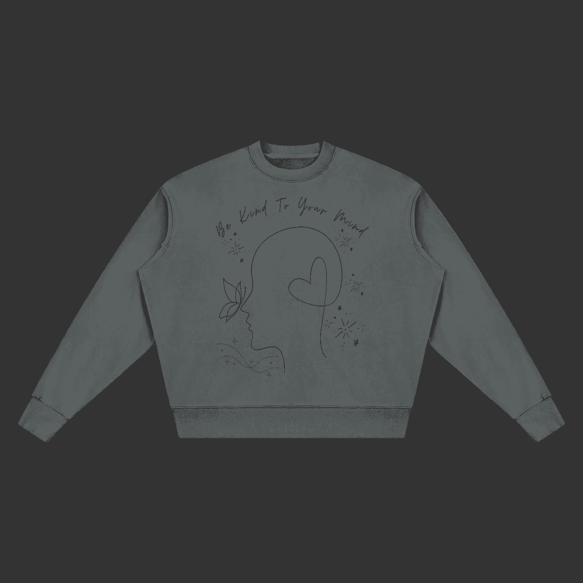 A dark gray crewneck sweatshirt with a black line art graphic of a face profile, a heart, a butterfly, and the text 'Be Kind To Your Mind' on the front, displayed on a solid gray background.