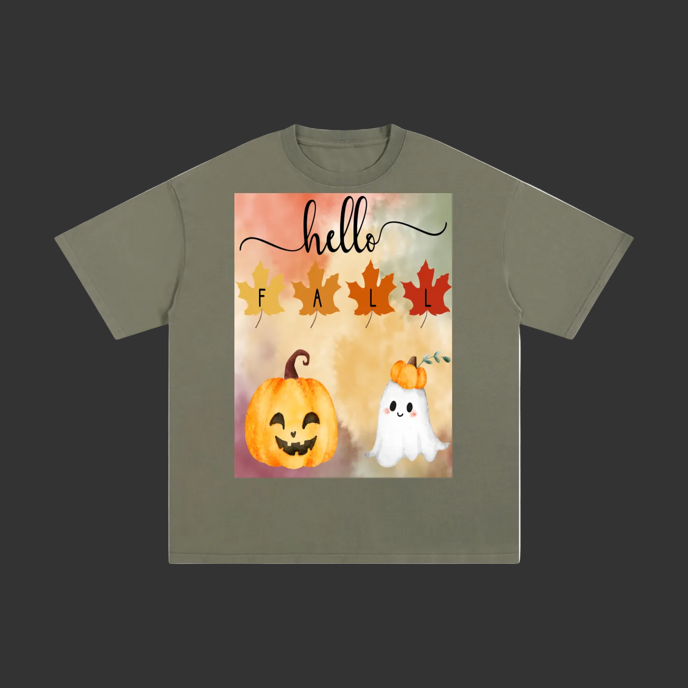 An olive green short-sleeve t-shirt with a square graphic print on the front featuring the text 'hello FALL' in script and block lettering above watercolor illustrations of a smiling jack-o'-lantern pumpkin and a small white ghost.