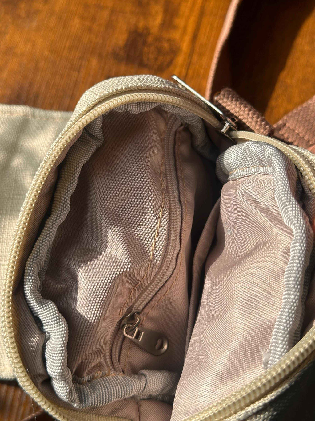 Interior view of floral crossbody phone pouch showing lined compartment and secure storage space for essentials
