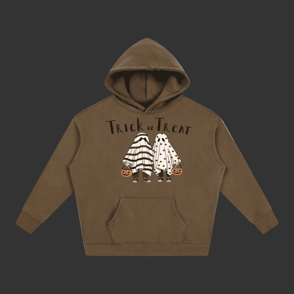 A brown pullover hoodie with a 'Trick or Treat' graphic featuring two cartoon ghosts in Halloween costumes holding pumpkins, displayed on a solid gray background.