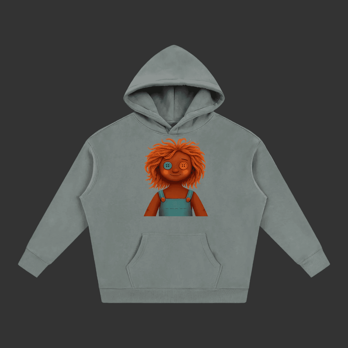 A gray pullover hoodie featuring a cartoon graphic of a doll with orange hair and blue overalls on the chest, displayed against a solid gray background.