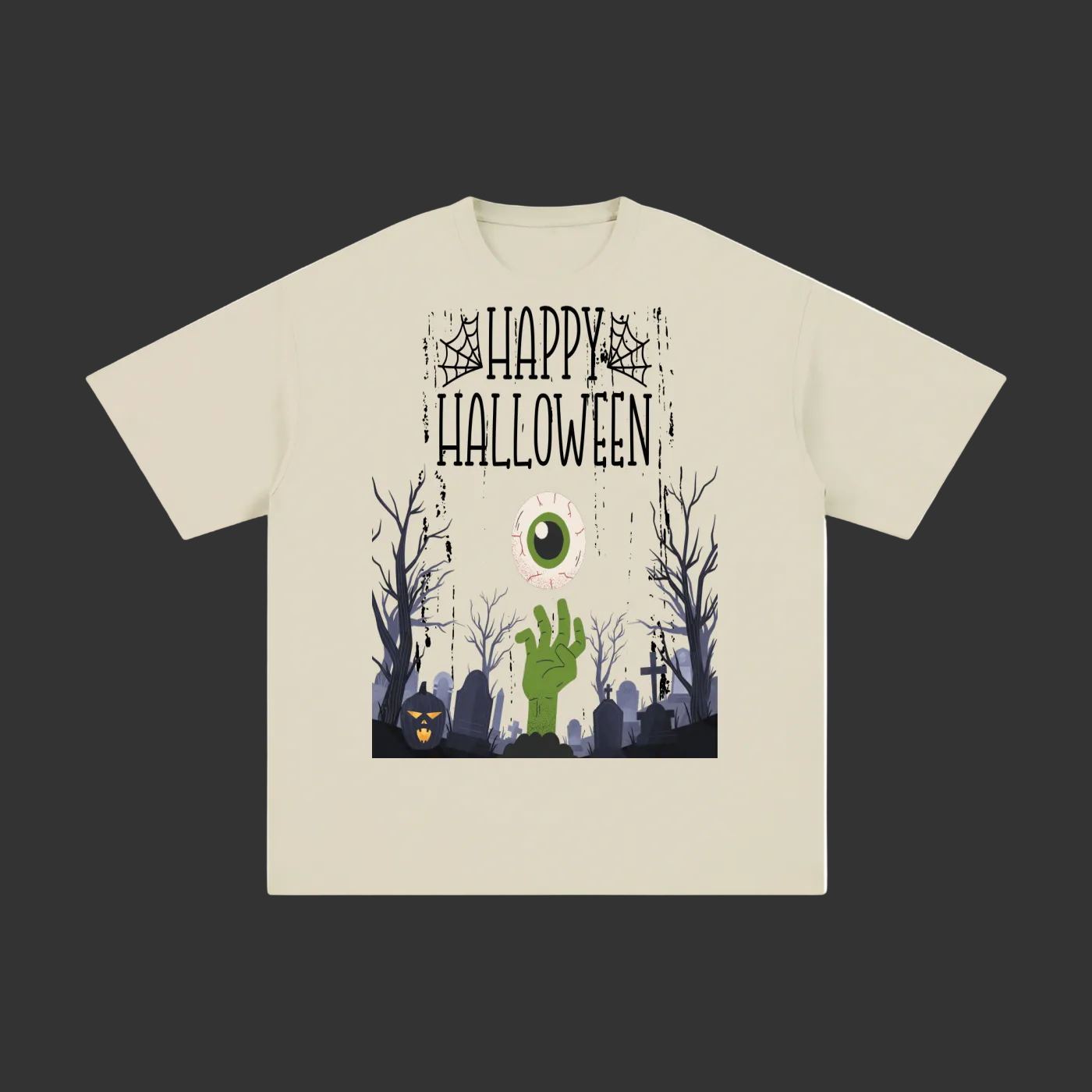 A light beige short-sleeve t-shirt with a graphic print on the front featuring the text 'Happy Halloween' above a spooky graveyard scene with a green zombie hand, bare trees, and a jack-o'-lantern.