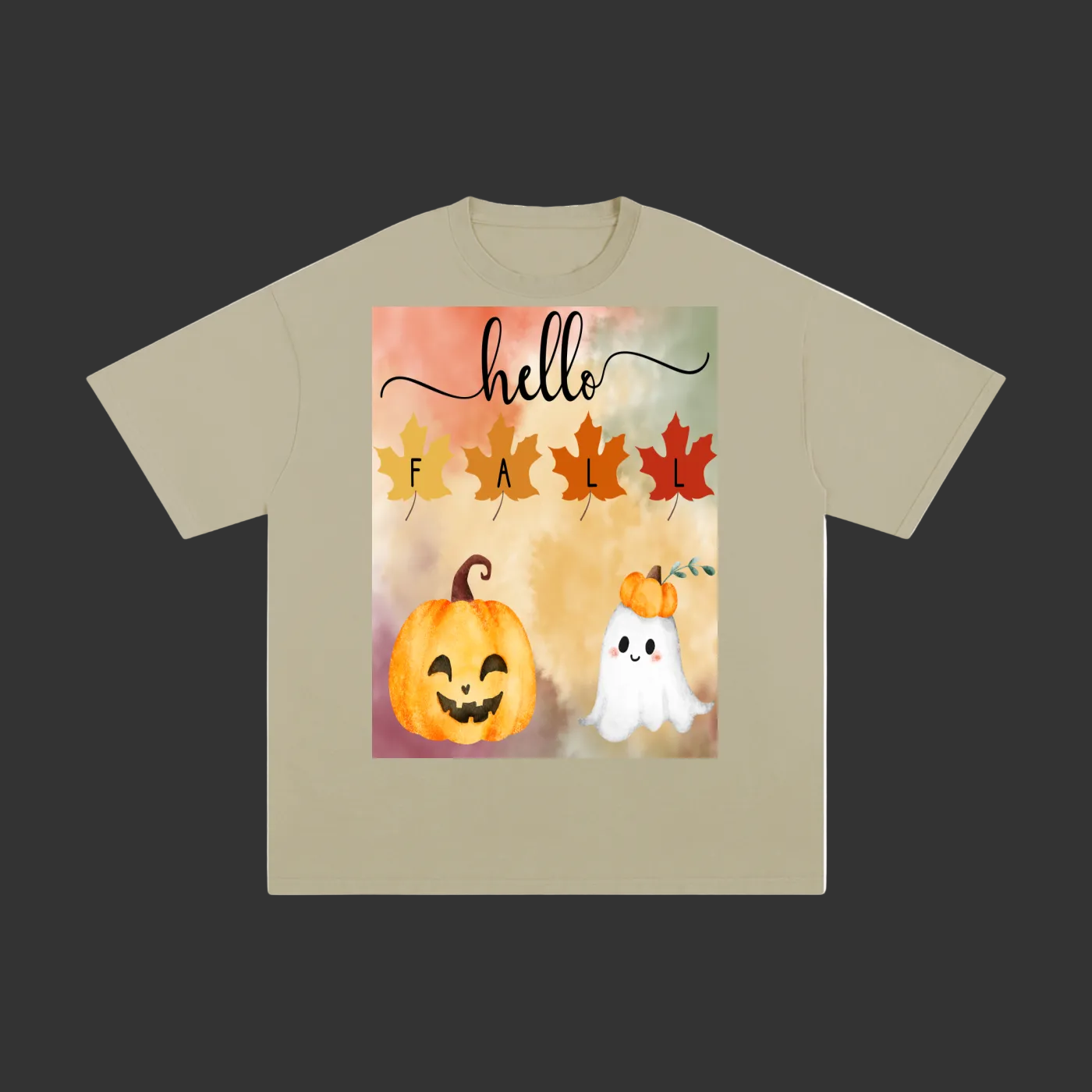 A beige short-sleeve t-shirt with a colorful 'Hello Fall' graphic print on the front, featuring a watercolor autumn design with leaves, pumpkins, and a ghost.