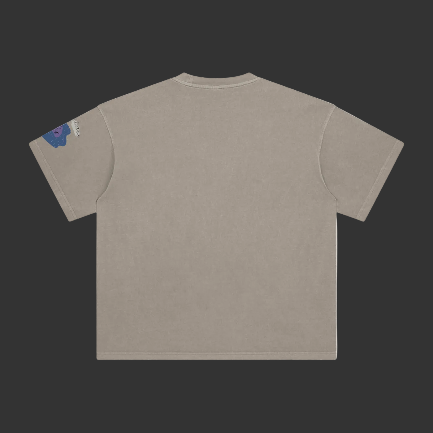 A short-sleeve crewneck t-shirt shown from the back, in a washed taupe color. A small blue and white graphic is printed on the left sleeve.
