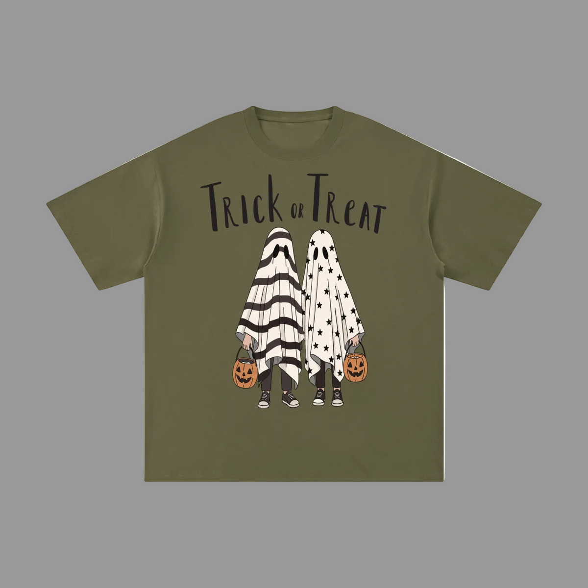 An olive green short-sleeve t-shirt with a 'Trick or Treat' Halloween graphic on the front, featuring two ghost characters in black-and-white and white polka-dot costumes holding jack-o'-lantern buckets, shown on a plain gray background.