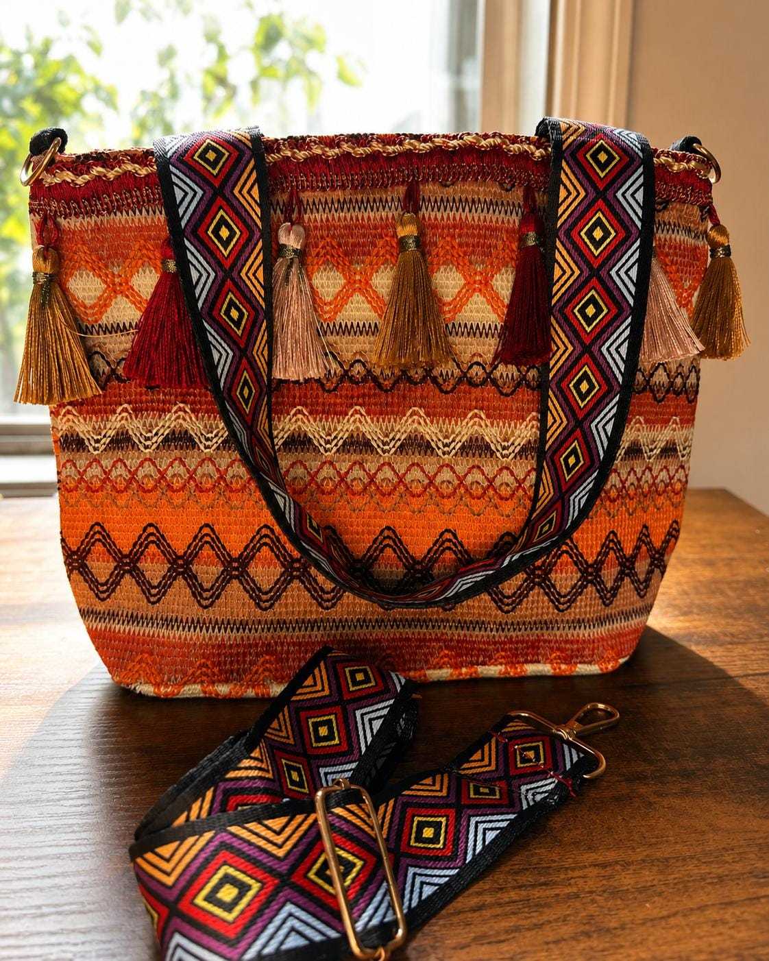 Vibrant woven tote bag with tassels and geometric design