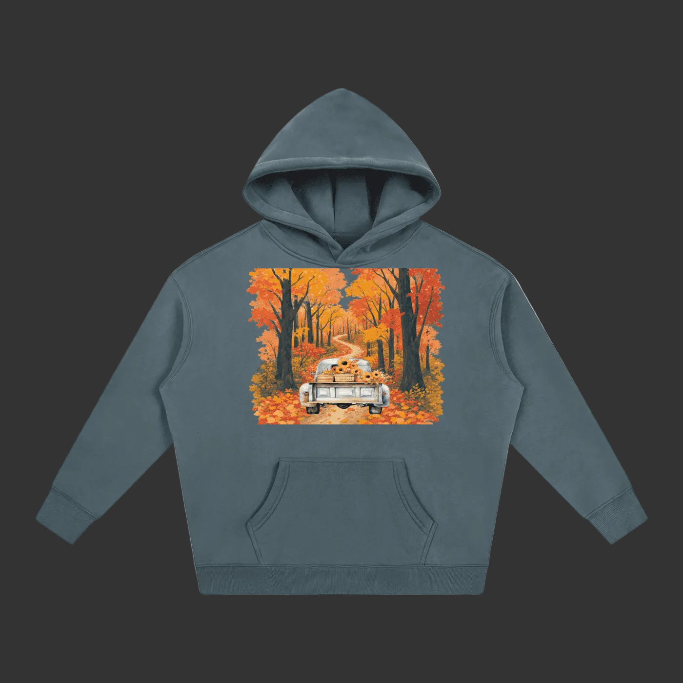 A slate blue-gray pullover hoodie with a front kangaroo pocket and a large square graphic print on the chest showing a vintage car driving through an autumn forest with orange and red trees.