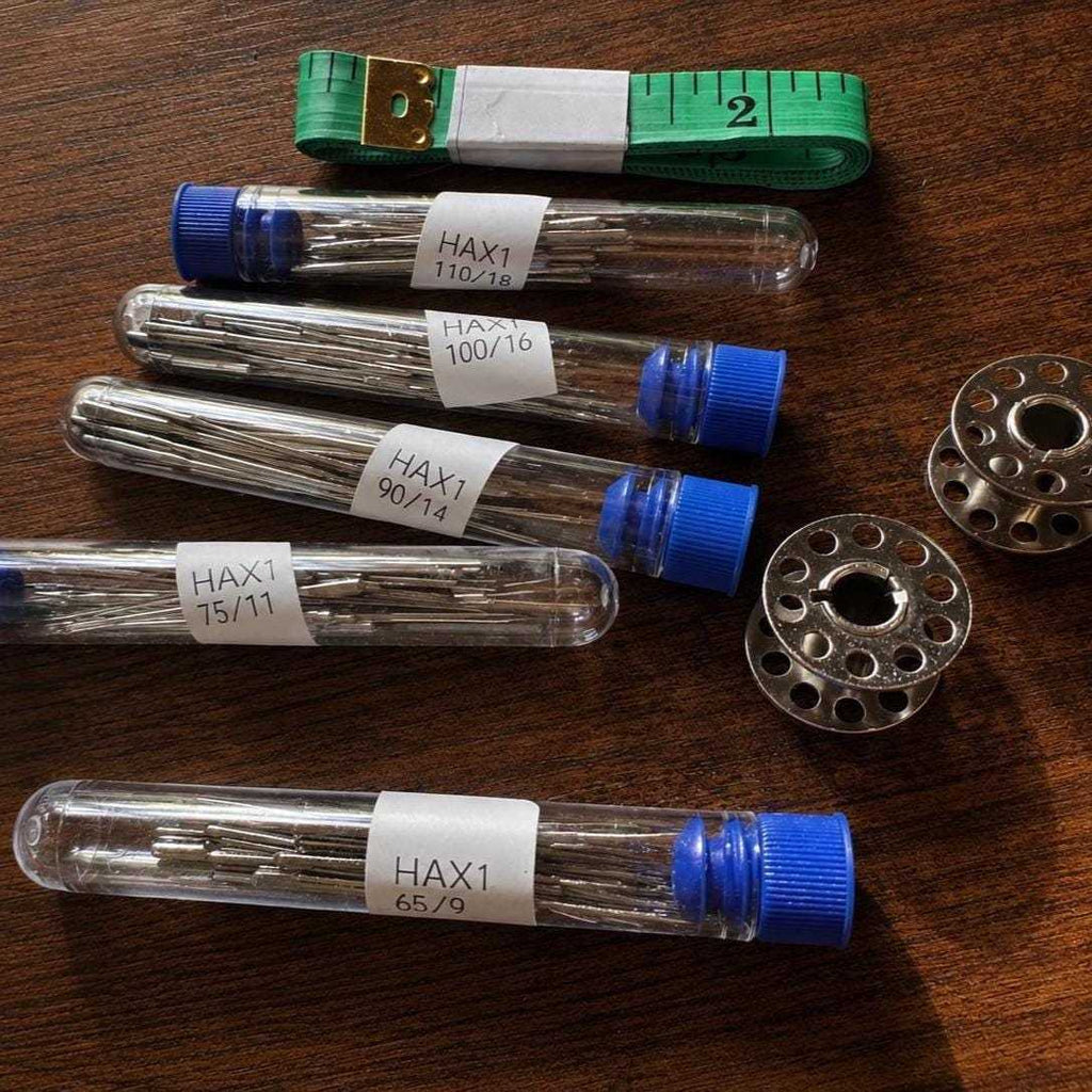 Sewing machine needles with fabric measurement tape for all fabrics