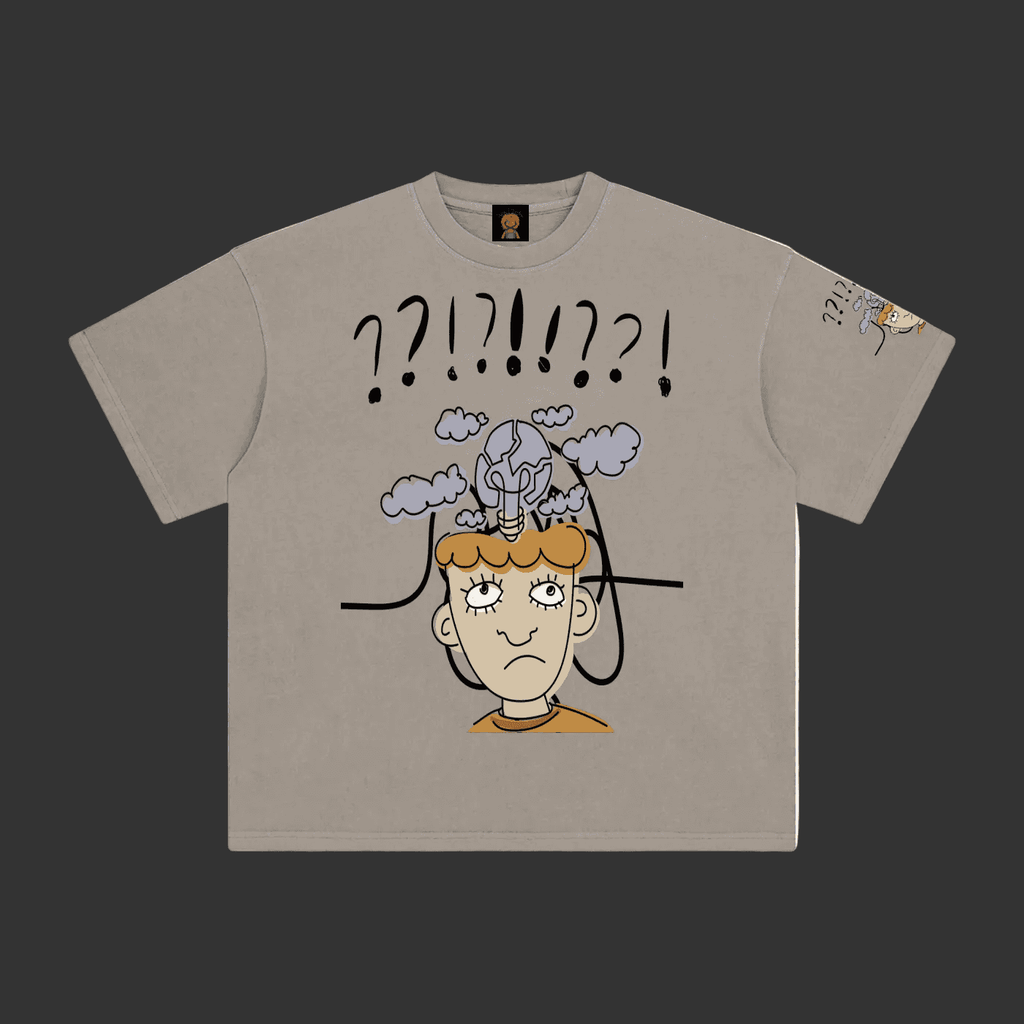 A light gray crewneck t-shirt featuring a cartoon graphic of a confused person with a lightbulb on their head and question marks above, shown on a plain gray background.