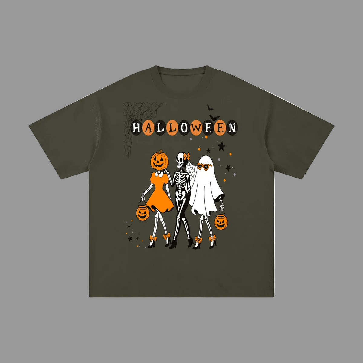 An olive green short-sleeve t-shirt with a Halloween-themed graphic print featuring three cartoon skeletons in costumes and the word 'HALLOWEEN' above them, displayed on a solid gray background.