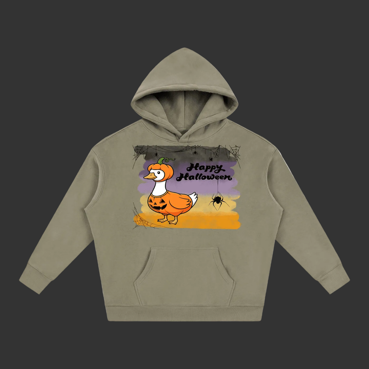 A sage green pullover hoodie with a 'Happy Halloween' graphic on the chest, featuring a cartoon duck dressed in an orange pumpkin costume against a purple and orange sunset background.