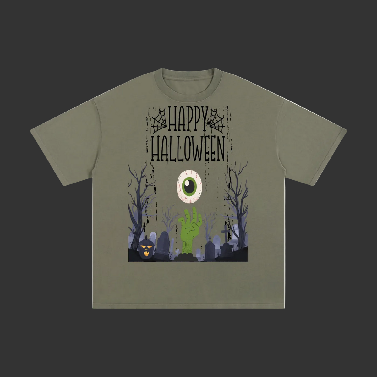 An olive green short-sleeve t-shirt with a Halloween graphic on the front. The graphic features the text 'HAPPY HALLOWEEN' above a spooky graveyard scene with bare trees, tombstones, a green zombie hand, and a large white eye with a green pupil.