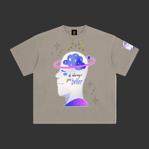 A taupe gray short-sleeve t-shirt with a graphic of a white human head profile showing a blue starry brain, a pink ring, and the text 'it always gets better'.
