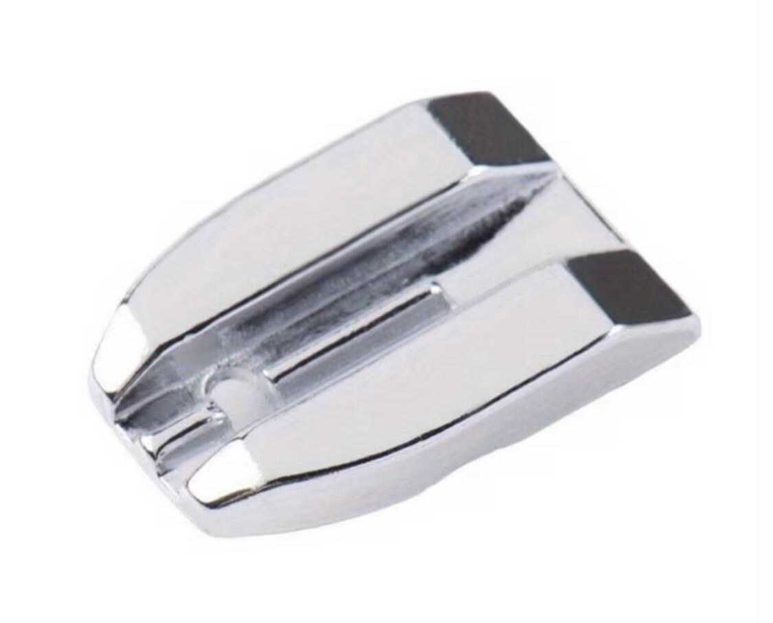 Close-up of invisible zipper presser foot guide attachment for creating clean concealed zipper seams