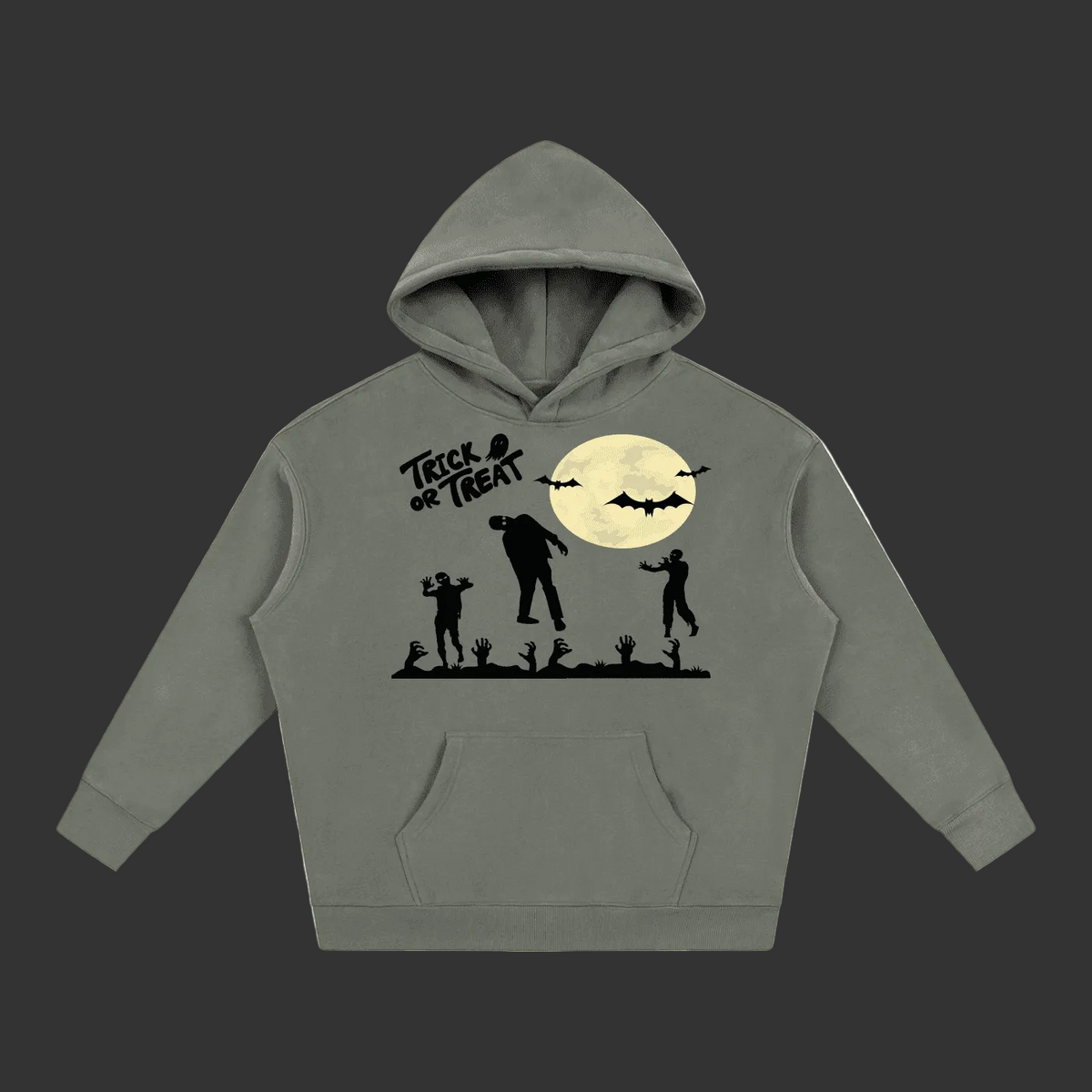 A adults unisex gray pullover hoodie featuring a black and cream-colored Halloween graphic on the front, including a witch on a broomstick, bats, a full moon, pumpkins, and a spooky town silhouette.