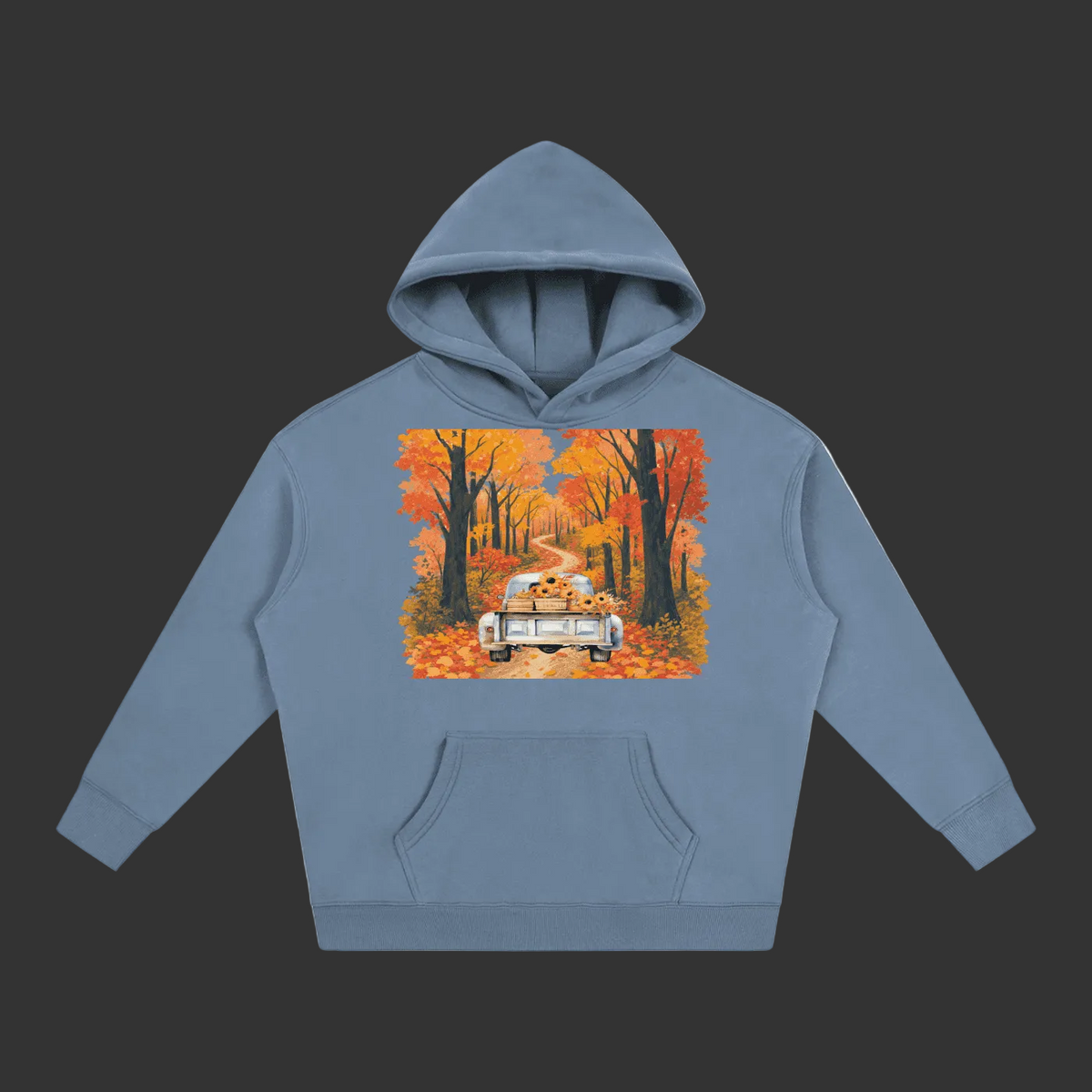 A dusty blue pullover hoodie with a front kangaroo pocket and a colorful graphic print on the chest depicting a vintage car driving down an autumn forest road.