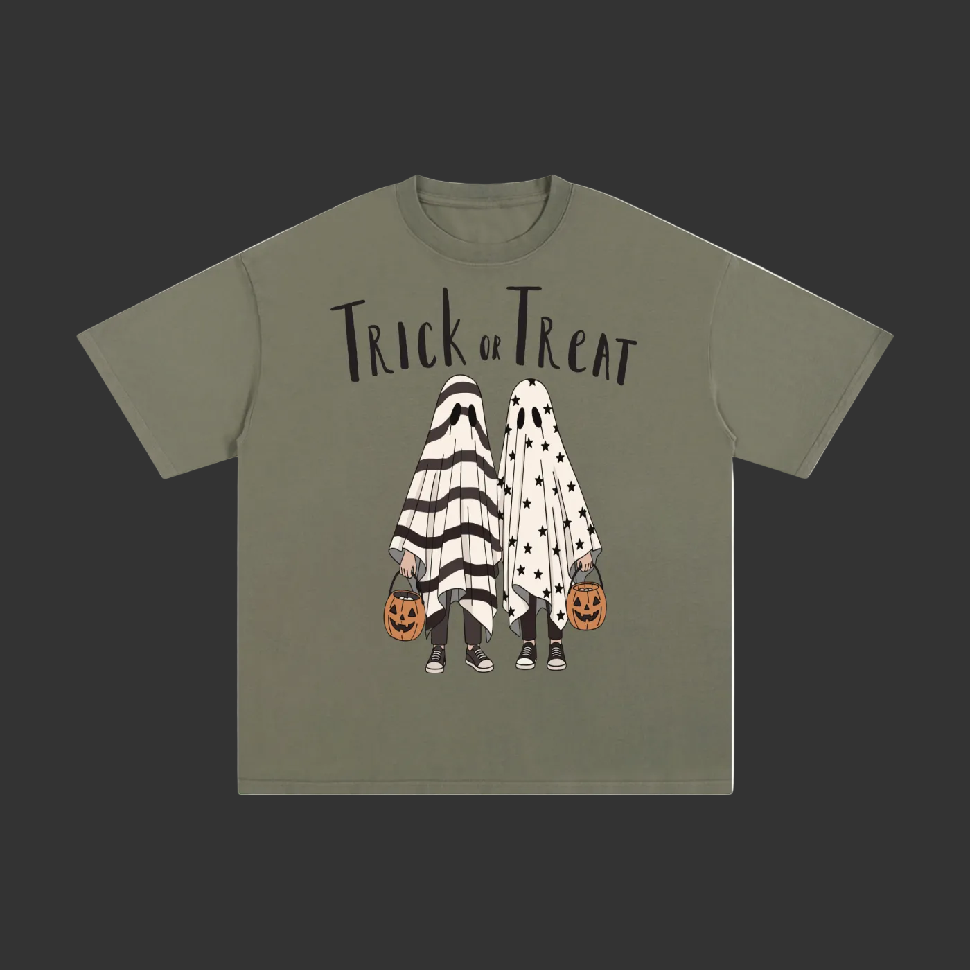 An olive green short-sleeve t-shirt with a 'Trick or Treat' Halloween graphic on the front, featuring two ghost figures in black-and-white and white-and-black patterns holding jack-o'-lantern buckets, shown on a plain gray background.