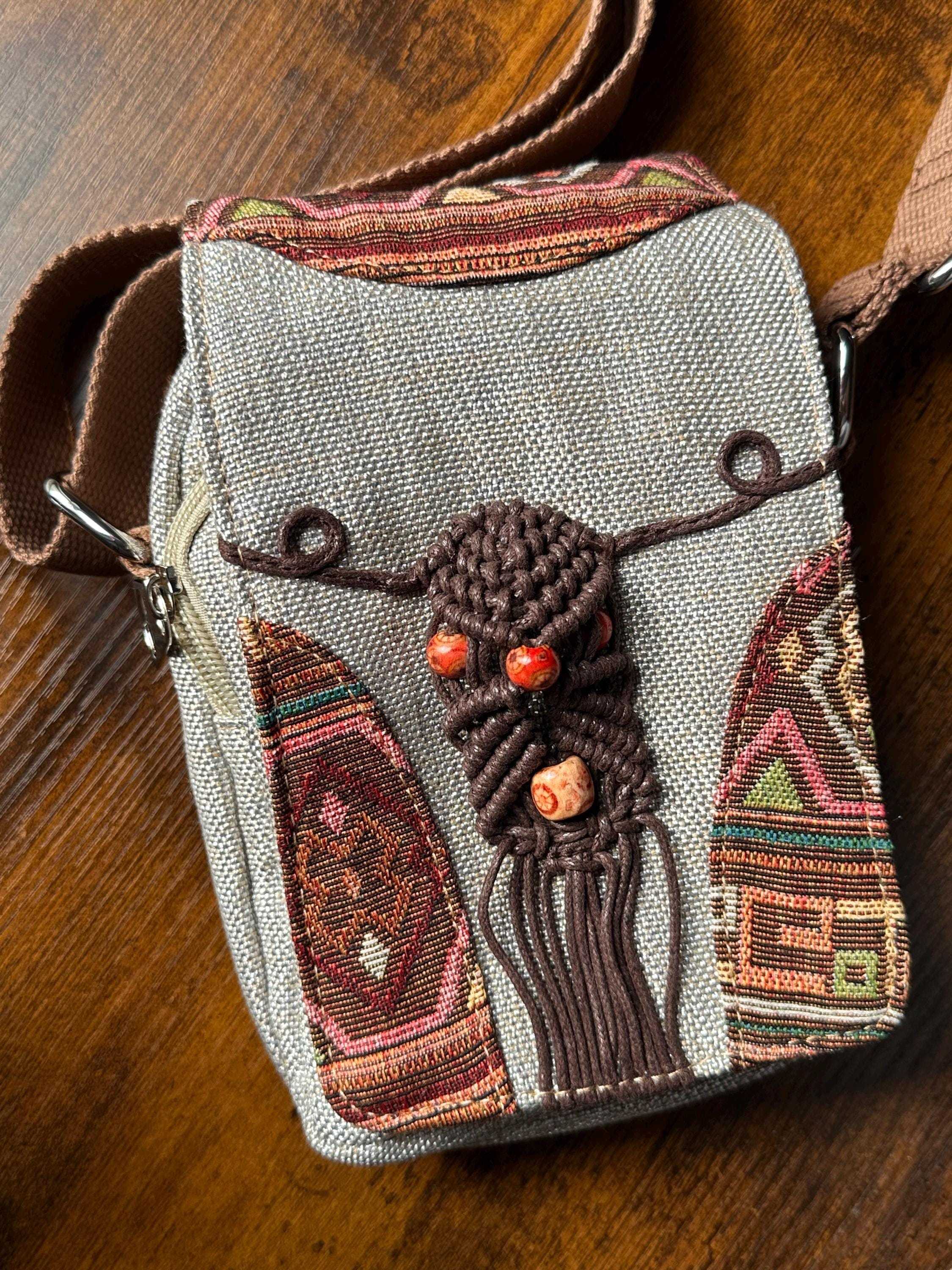 Close-up of boho woven crossbody bag with decorative beads and embroidery