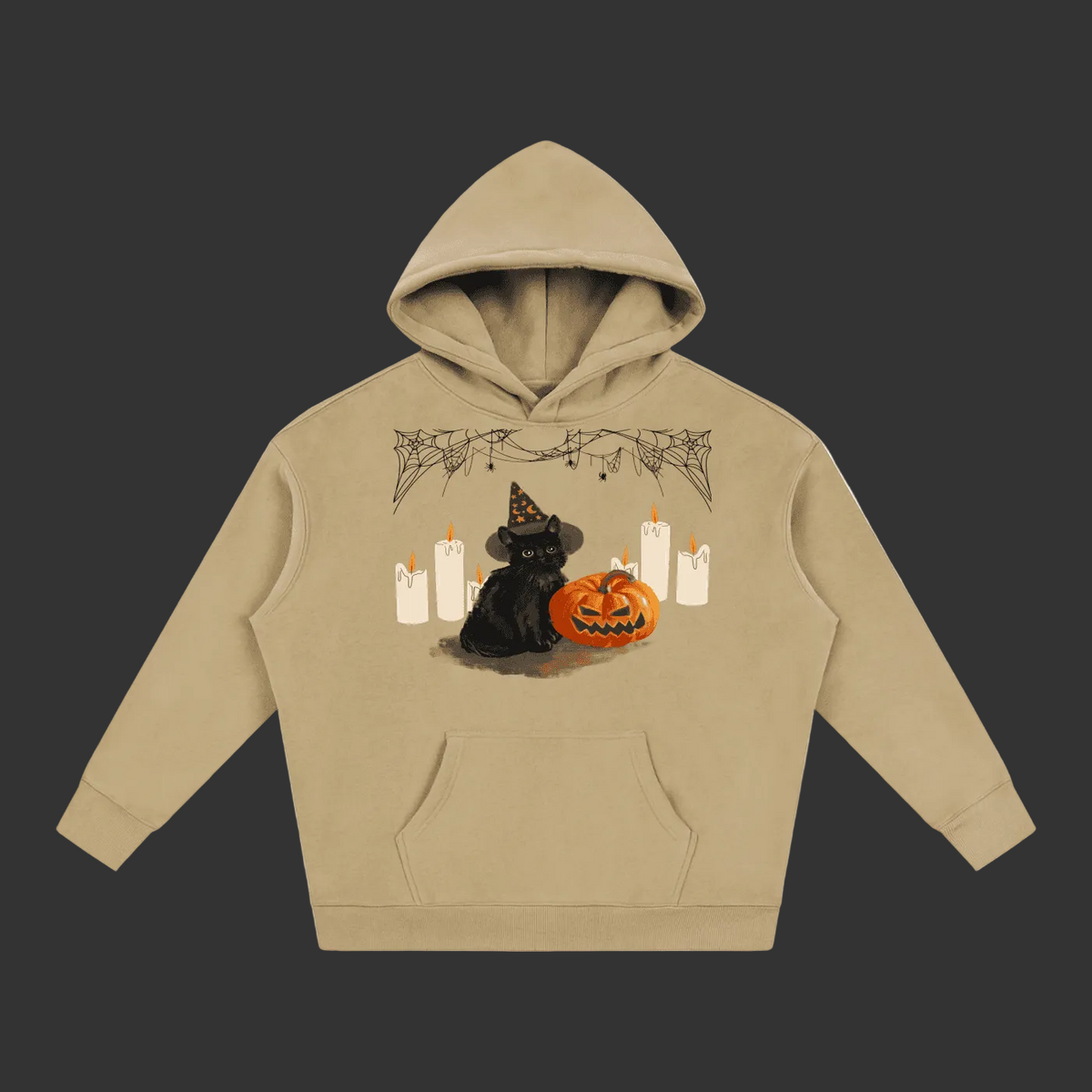 A beige pullover hoodie featuring a Halloween graphic of a black cat in a witch hat next to a jack-o'-lantern pumpkin and white candles, displayed on a clean gray background.