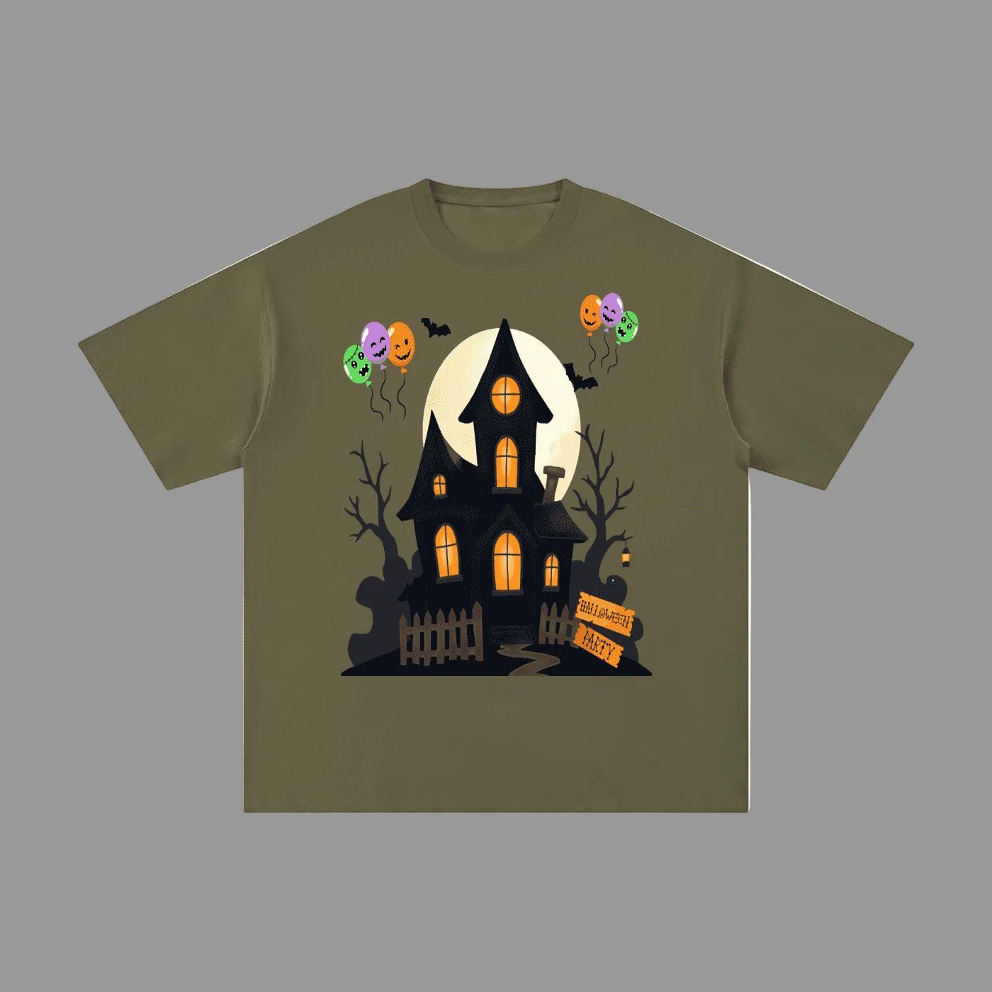 An olive green short-sleeve t-shirt with a graphic of a spooky haunted house, a full moon, jack-o'-lantern balloons, and bare trees on a graybackground.