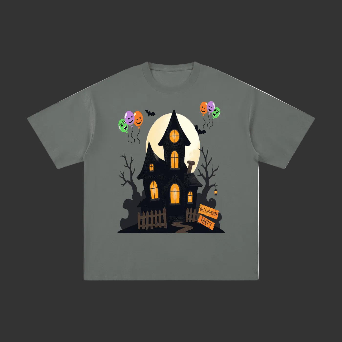 A dark gray short-sleeve t-shirt with a graphic of a haunted house, a full moon, jack-o'-lantern balloons, and bare trees on a gray background.