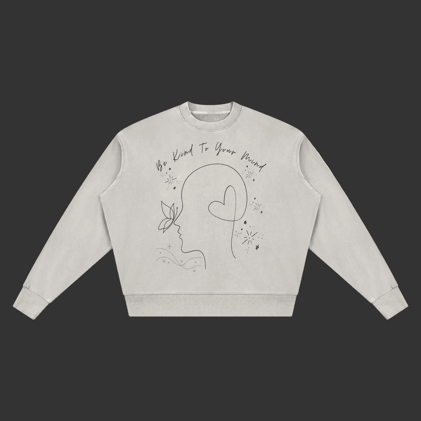 A light gray crewneck sweatshirt with a black line art graphic of a face, butterfly, and heart, accompanied by the text 'Be Kind To Your Mind' on a plain gray background.