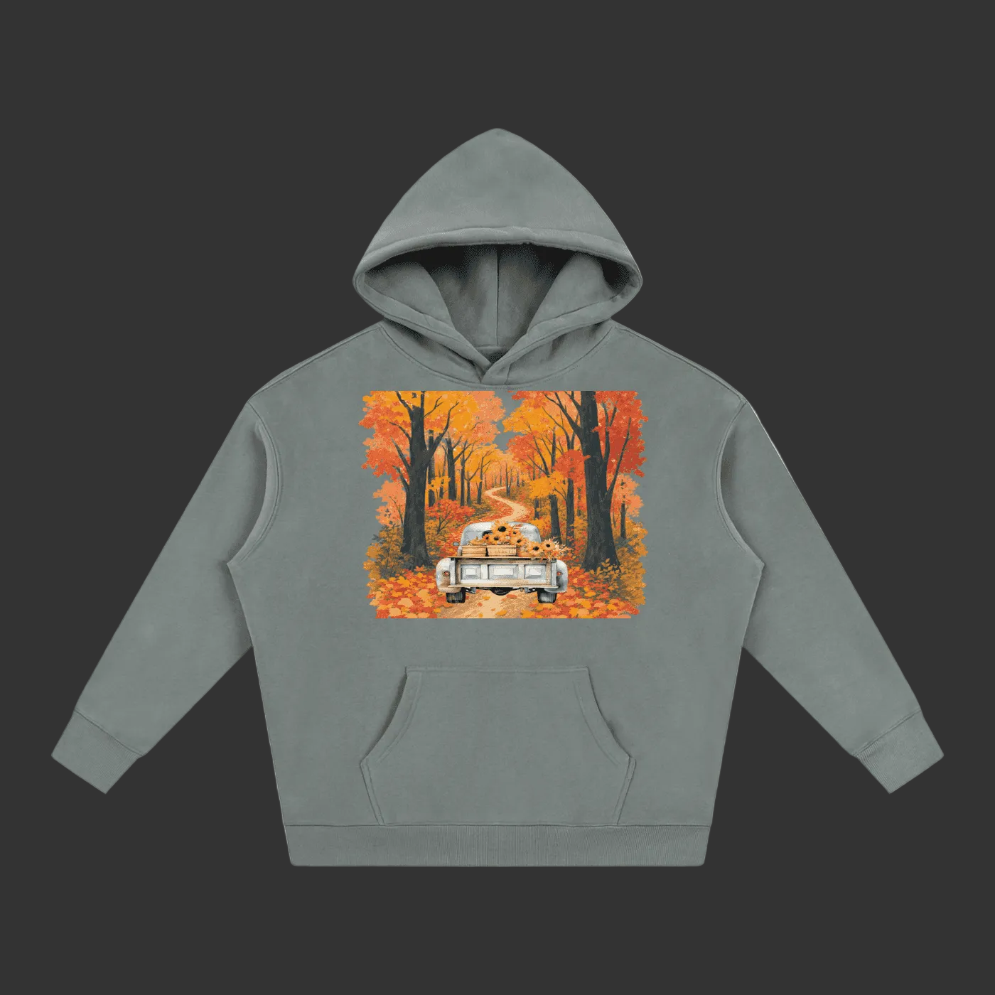 A gray pullover hoodie with a colorful graphic print on the chest showing a vintage car driving down a road lined with orange and yellow autumn trees, set against a plain gray background.