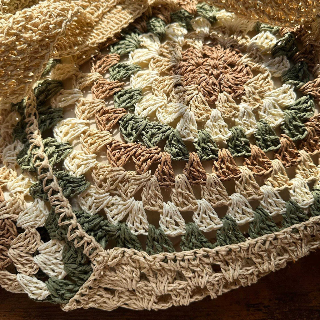 Detailed view of circular crochet stitching and woven texture on handmade boho tote bag