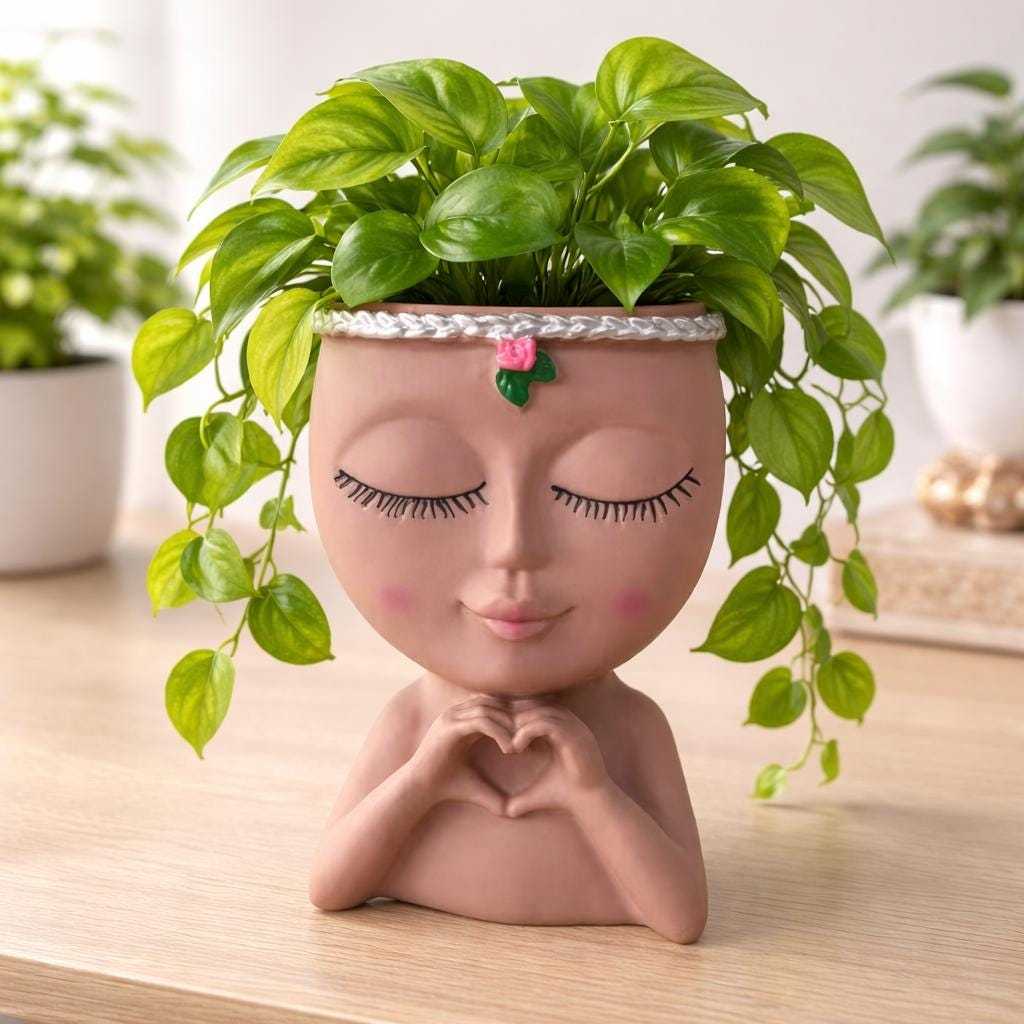 Multi-purpose decorative planter used as a makeup brush holder with lush green trailing plant for modern home décor
