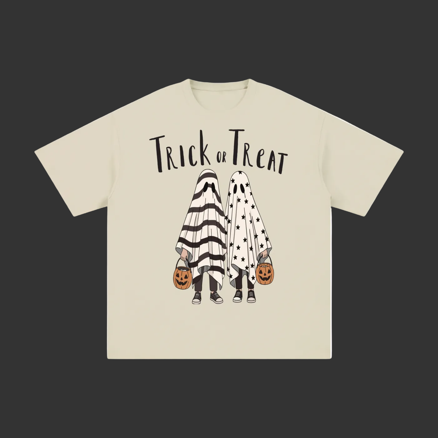 A beige short-sleeve t-shirt with a 'Trick or Treat' Halloween graphic on the front, featuring two children in ghost costumes holding jack-o'-lantern buckets, displayed on a clean gray background.