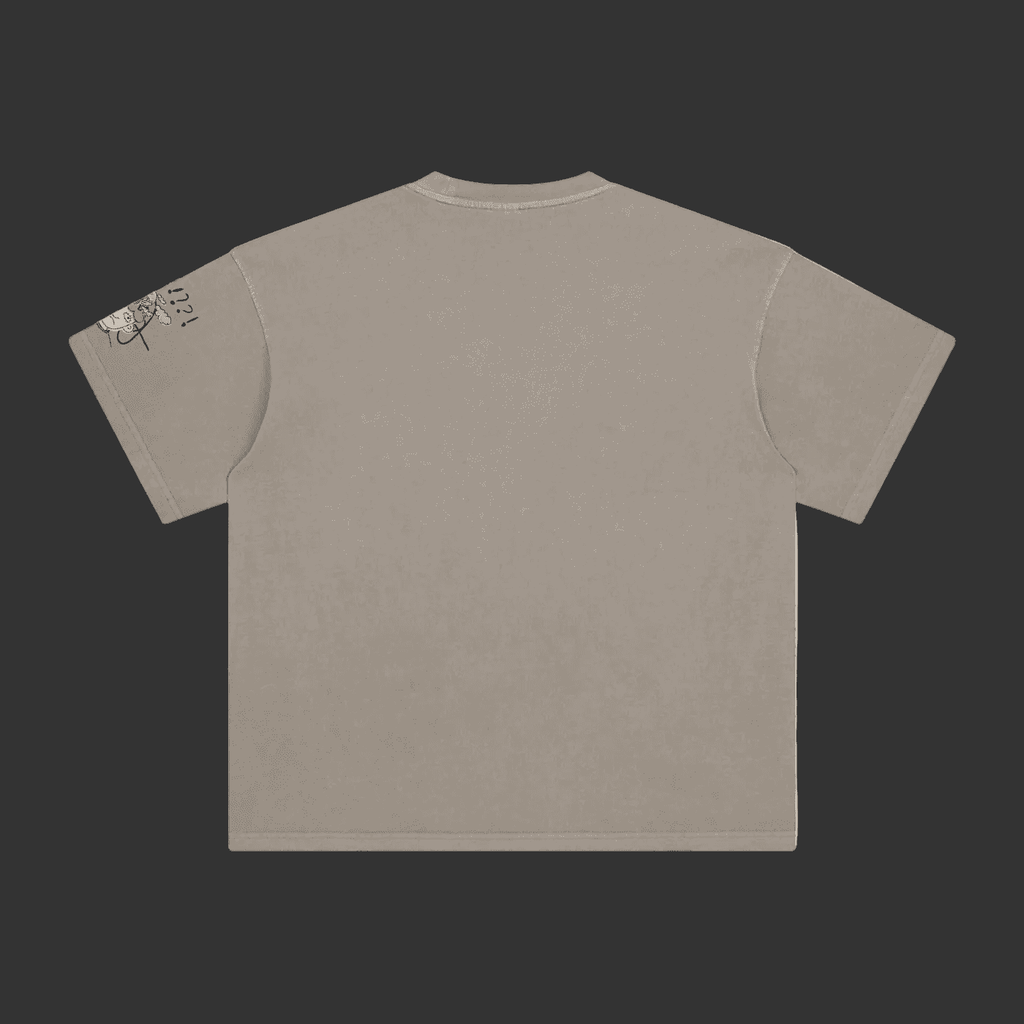 A short-sleeve crewneck t-shirt in a washed taupe-gray color, shown from the back. The left sleeve features a small graphic print with yellow, blue, and black details.