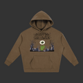 A brown pullover hoodie with a Halloween graphic on the chest, featuring the text 'Happy Halloween' above a spooky scene with a large eye, green hand, and bare trees, shown on a plain grey background.