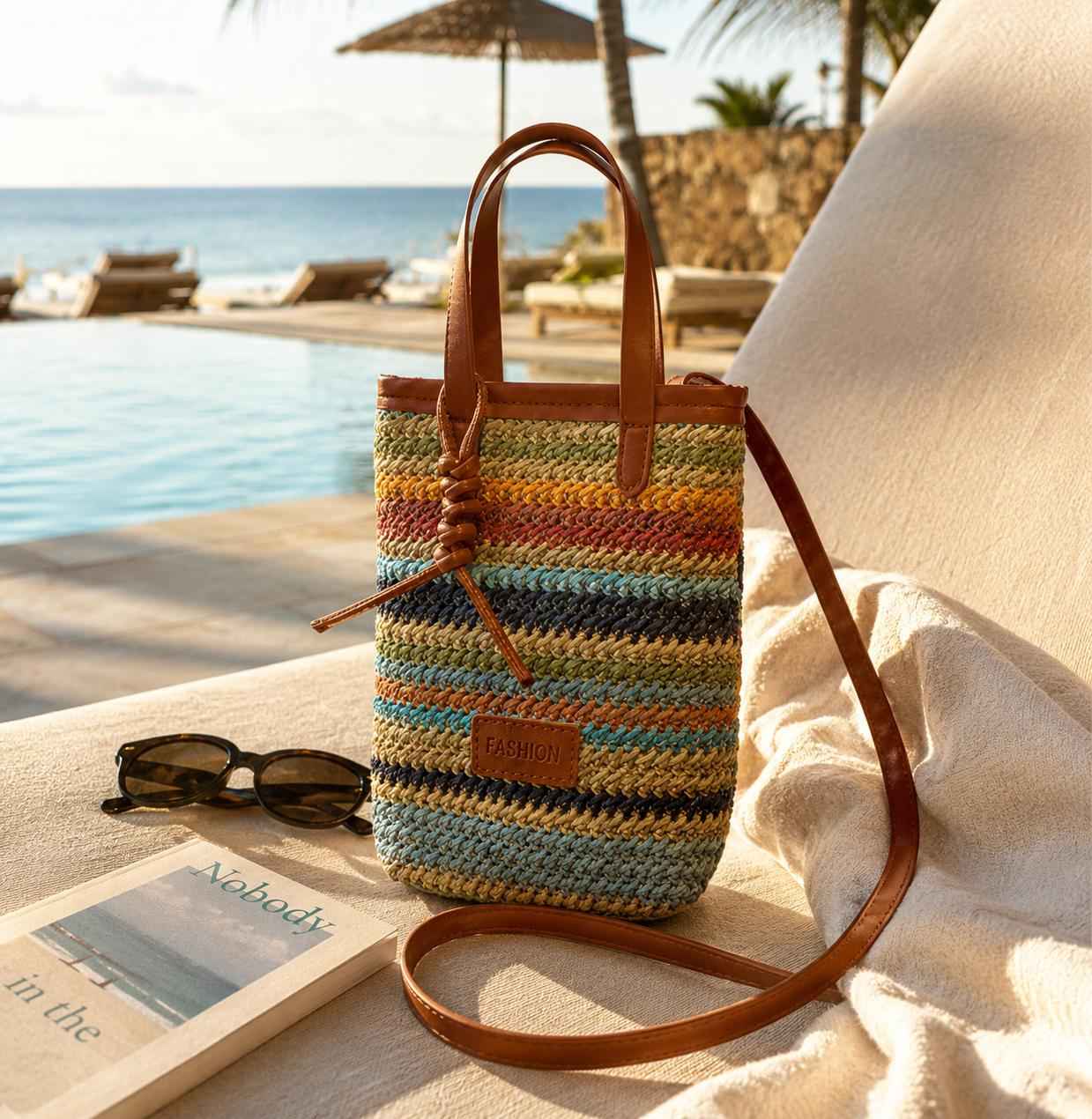 Colorful woven crossbody bag on beach lounge chair