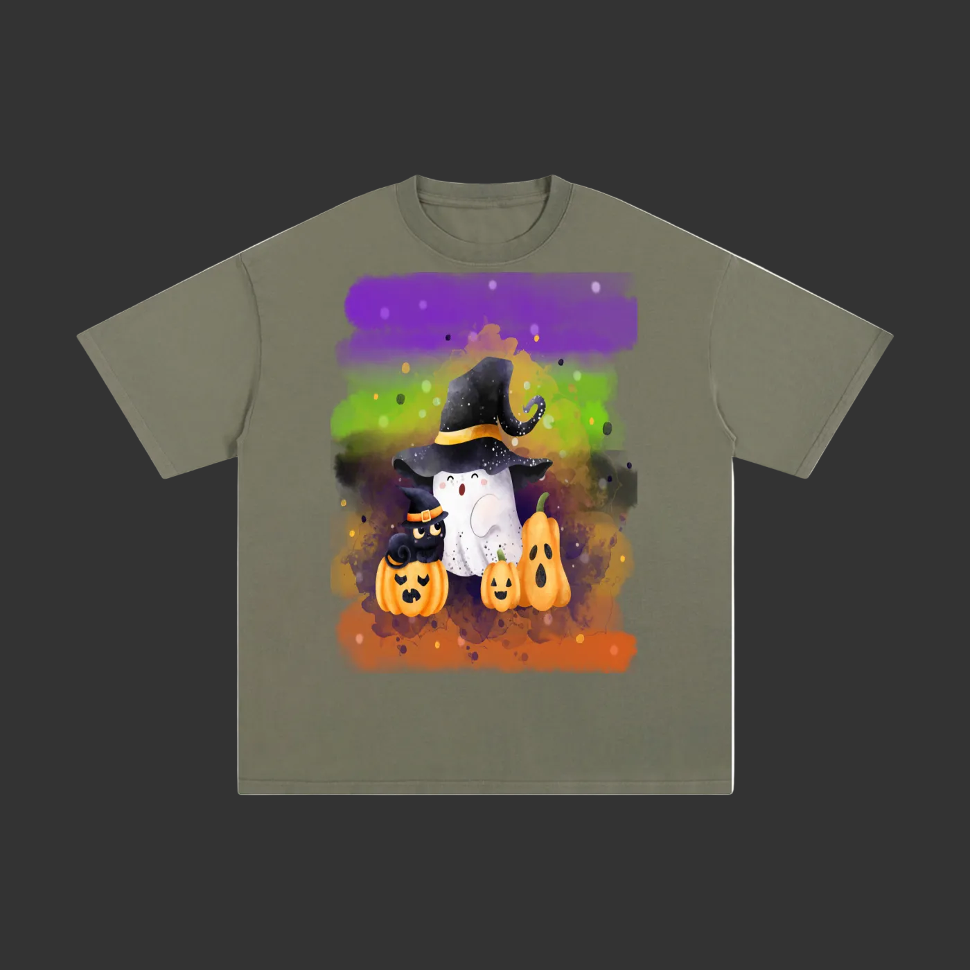 An olive green short-sleeve t-shirt with a colorful Halloween graphic on the front, featuring cartoon ghosts, pumpkins, and a witch hat on a purple, green, and orange watercolor background.