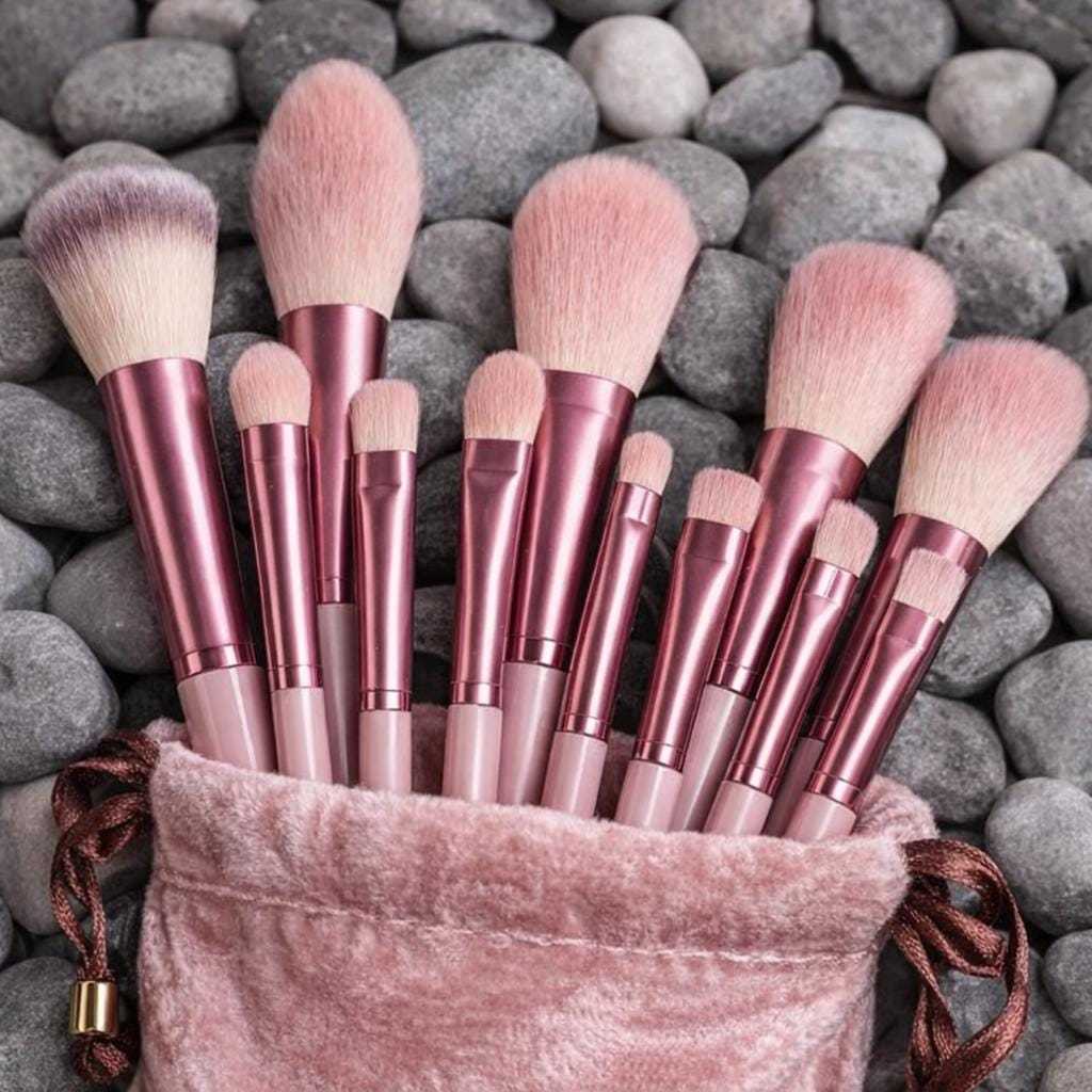 Pink makeup brushes with synthetic fibers in pouch