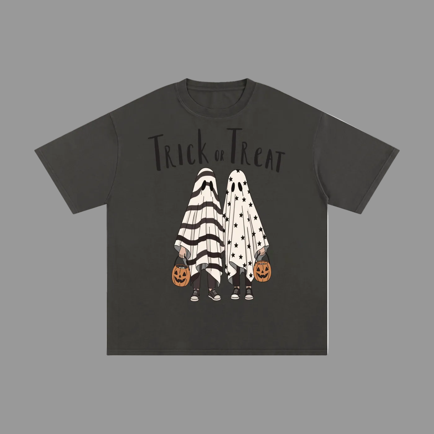 A dark gray short-sleeve t-shirt with a 'Trick or Treat' Halloween graphic on the front, featuring two ghost figures in black-and-white striped and black-and-white polka dot costumes holding jack-o'-lanterns, displayed on a solid gray background.