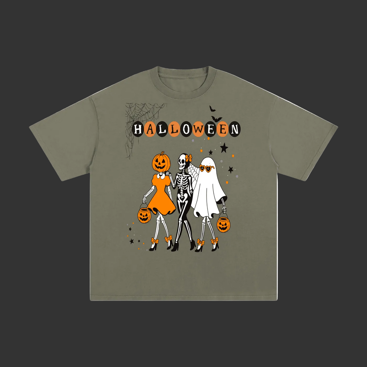 An olive green short-sleeve t-shirt with a Halloween graphic on the front, featuring three cartoon skeletons in orange, white, and black outfits with jack-o'-lanterns and the word 'HALLOWEEN' above them, displayed on a solid gray background.