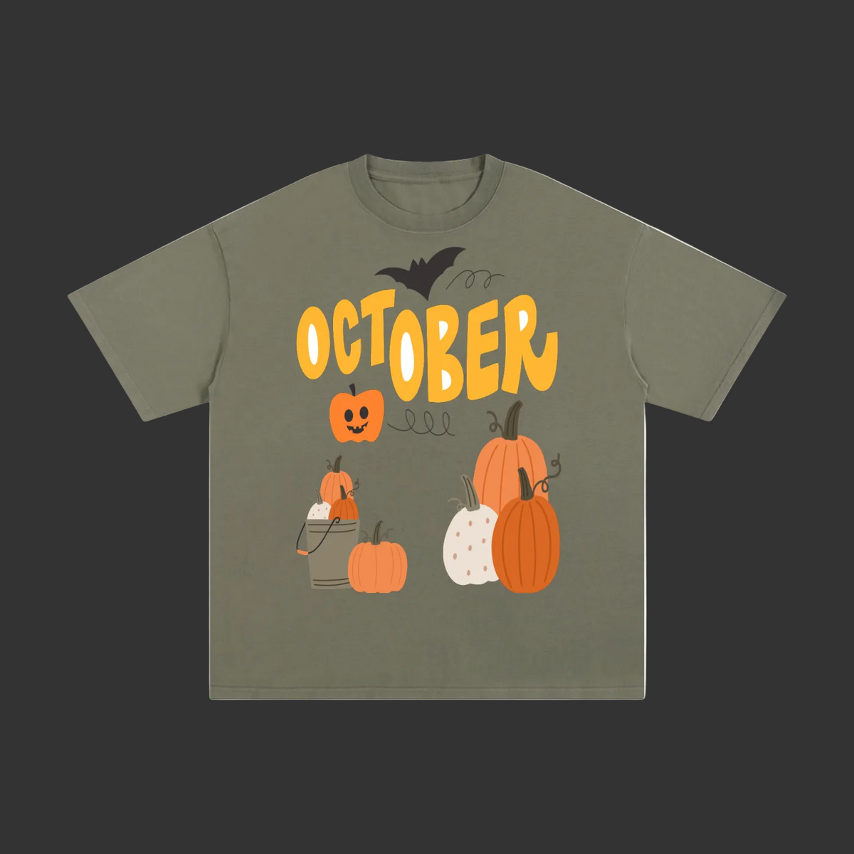 An olive green short-sleeve t-shirt with a Halloween graphic on the front featuring the word 'OCTOBER' in yellow, pumpkins, a jack-o'-lantern, a spider, and a bat.