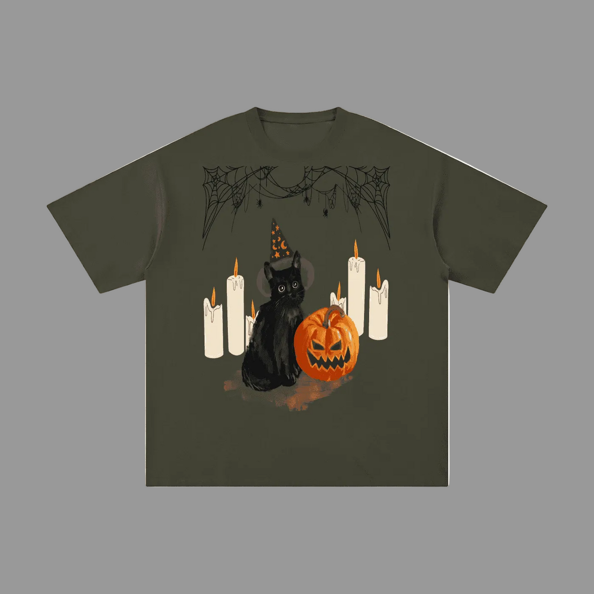An olive green short-sleeve t-shirt with a Halloween graphic print featuring a black cat in a witch hat, a jack-o'-lantern pumpkin, and white candles.