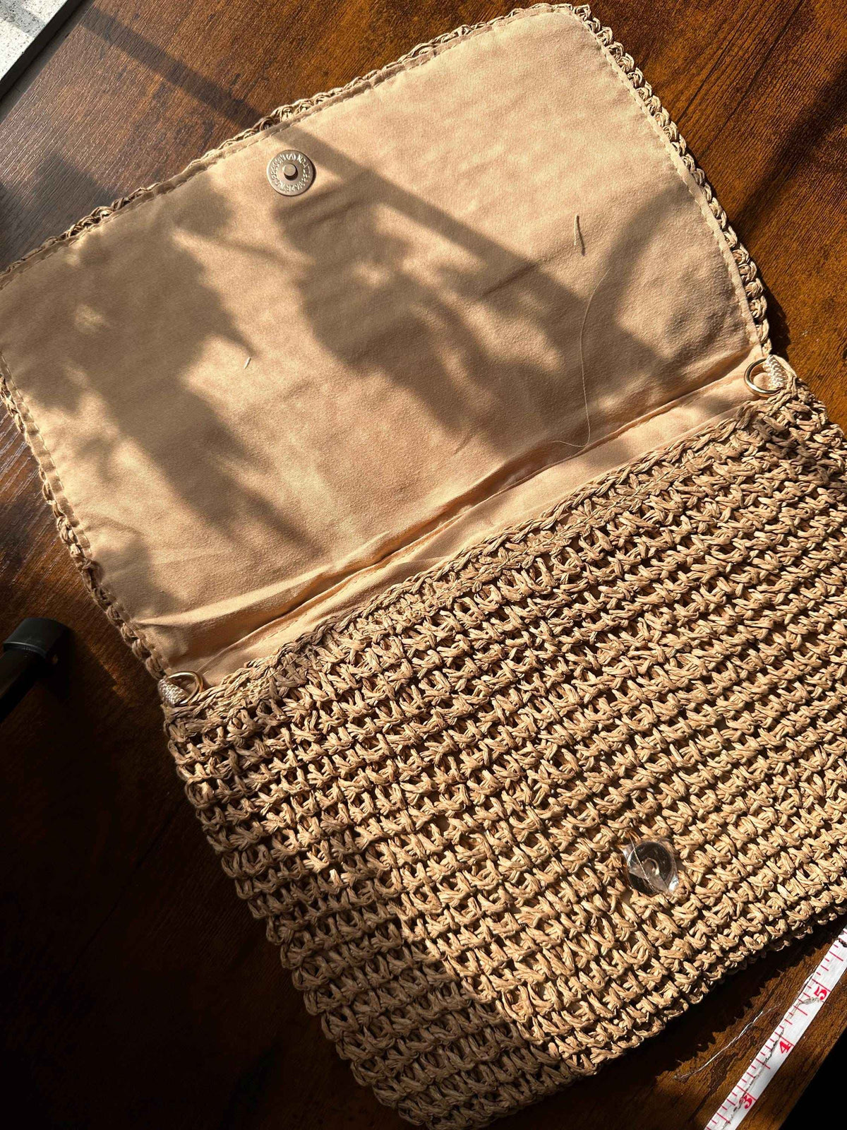 Open vintage granny square purse showing spacious interior lining and handcrafted woven construction
