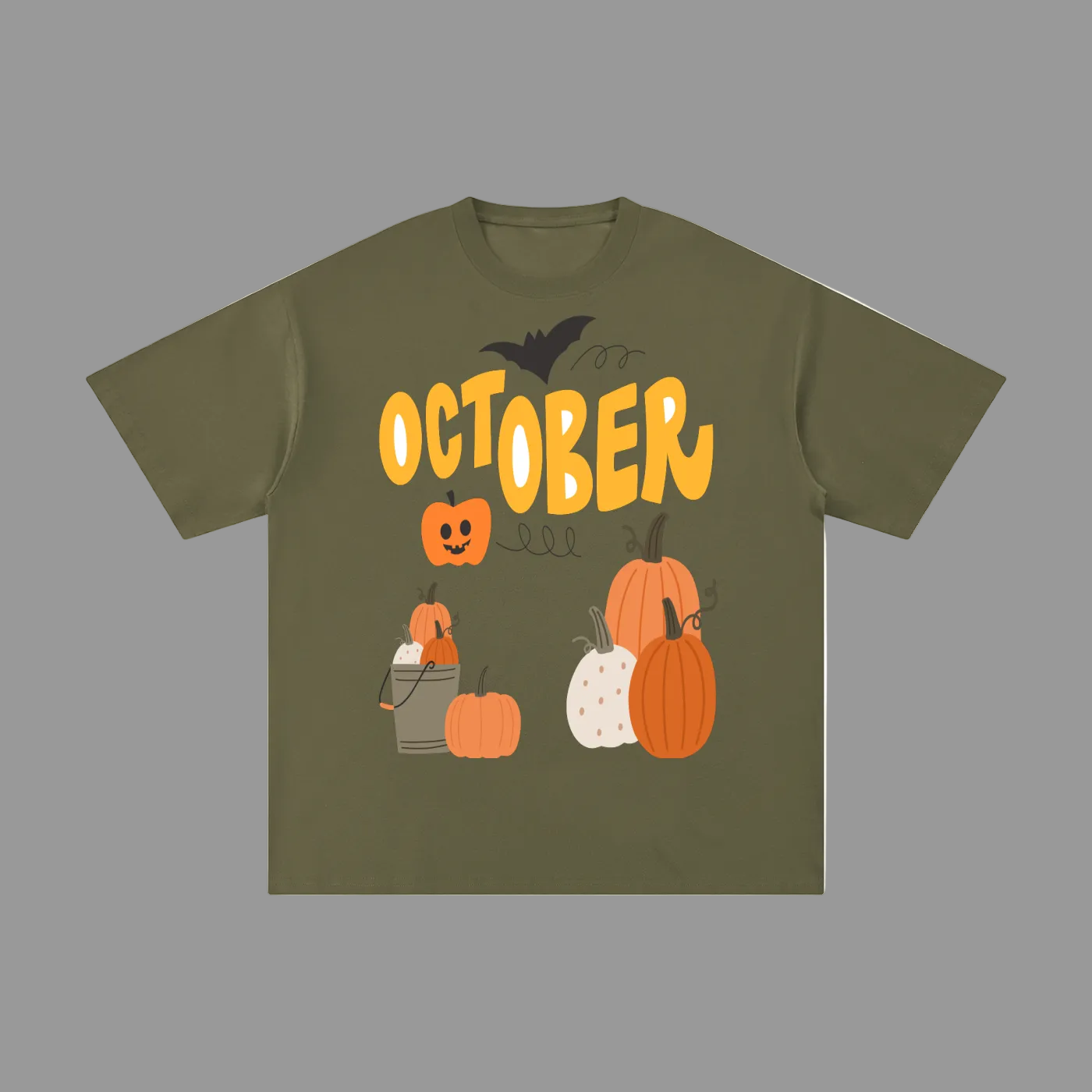 An olive green short-sleeve t-shirt with a Halloween graphic on the front. The graphic features the word 'OCTOBER' in yellow, a black bat, jack-o'-lanterns, and various pumpkins in orange, white, and brown.