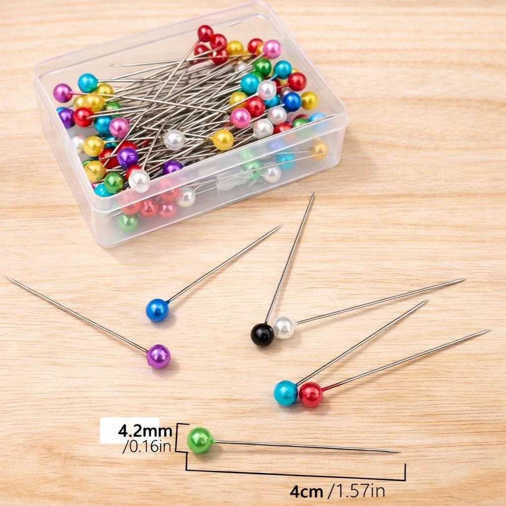 Colorful pearl head straight pins with size measurements displayed for sewing, quilting, and fabric crafting