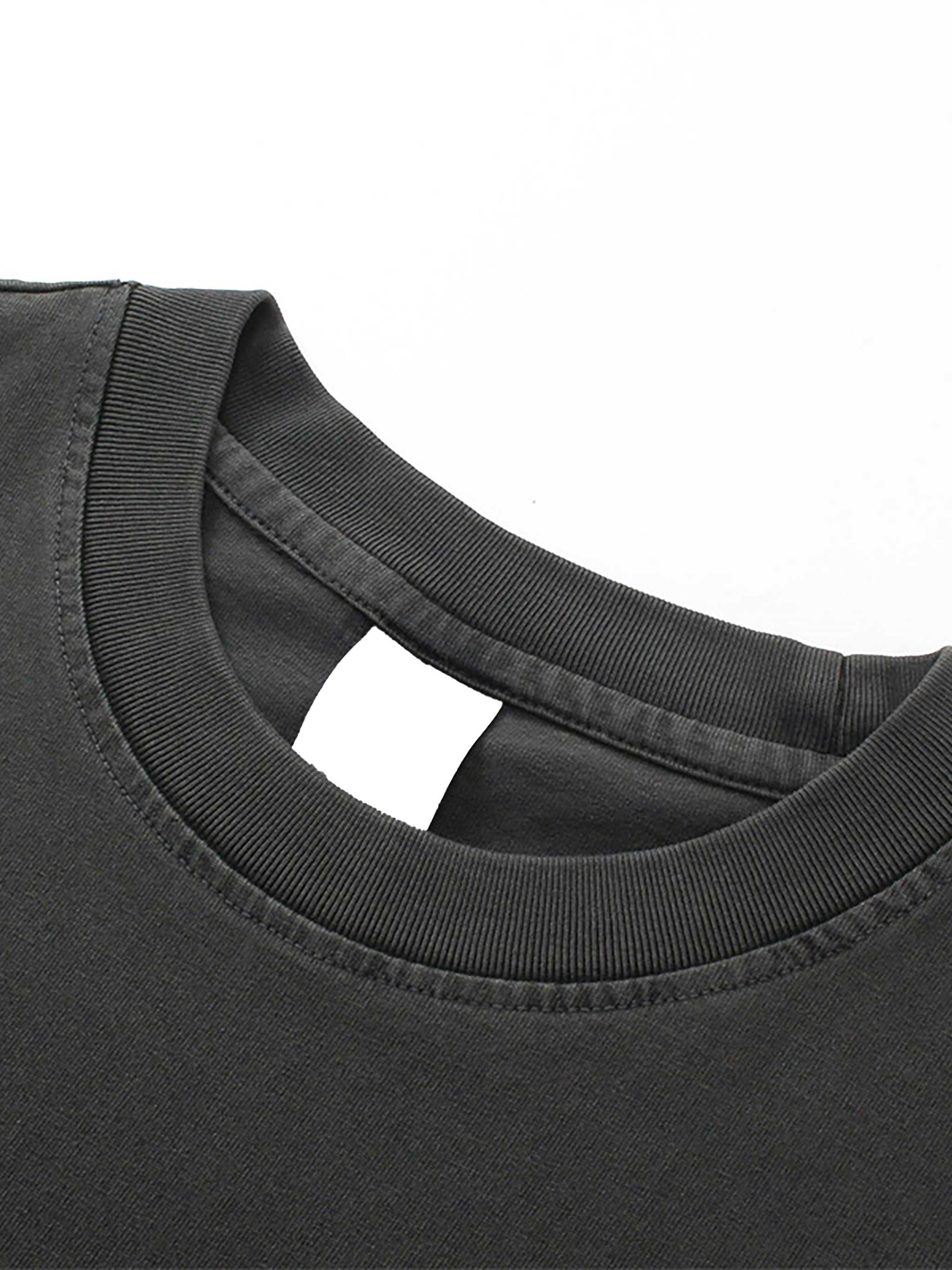 Close-up of a black t-shirt collar on a white background