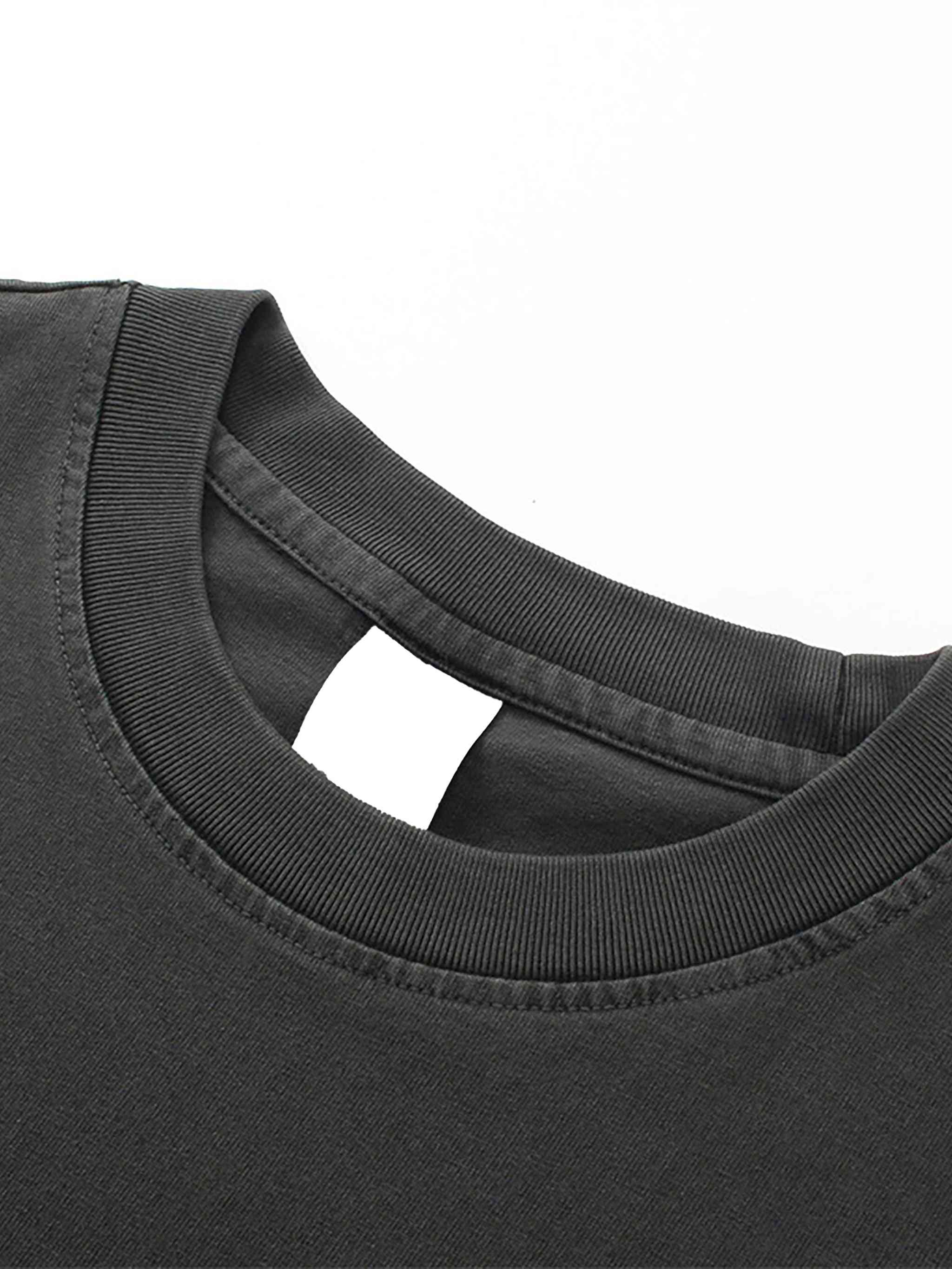 Close-up of a black t-shirt collar on a white background