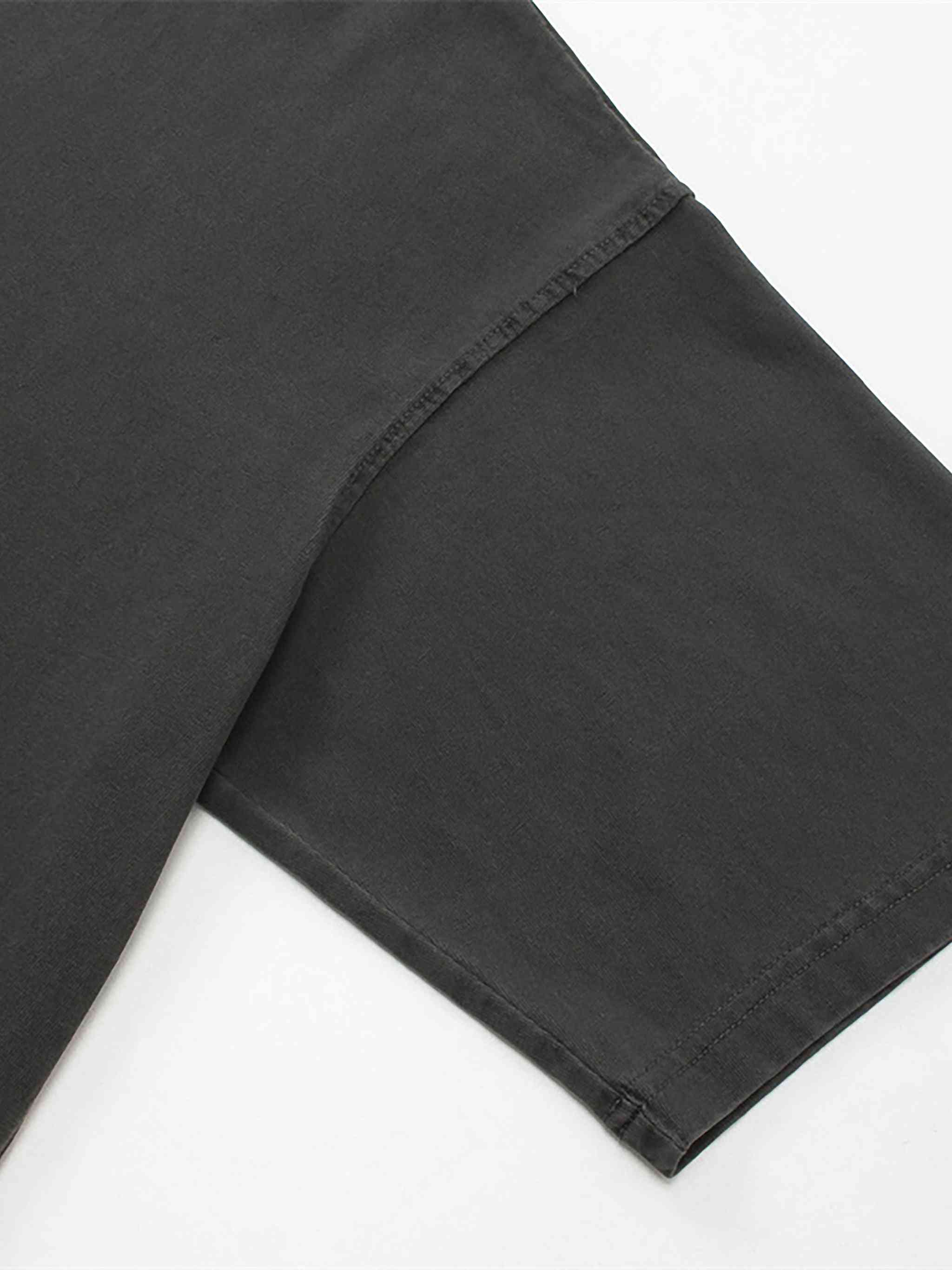 Close-up of black pants on a white background