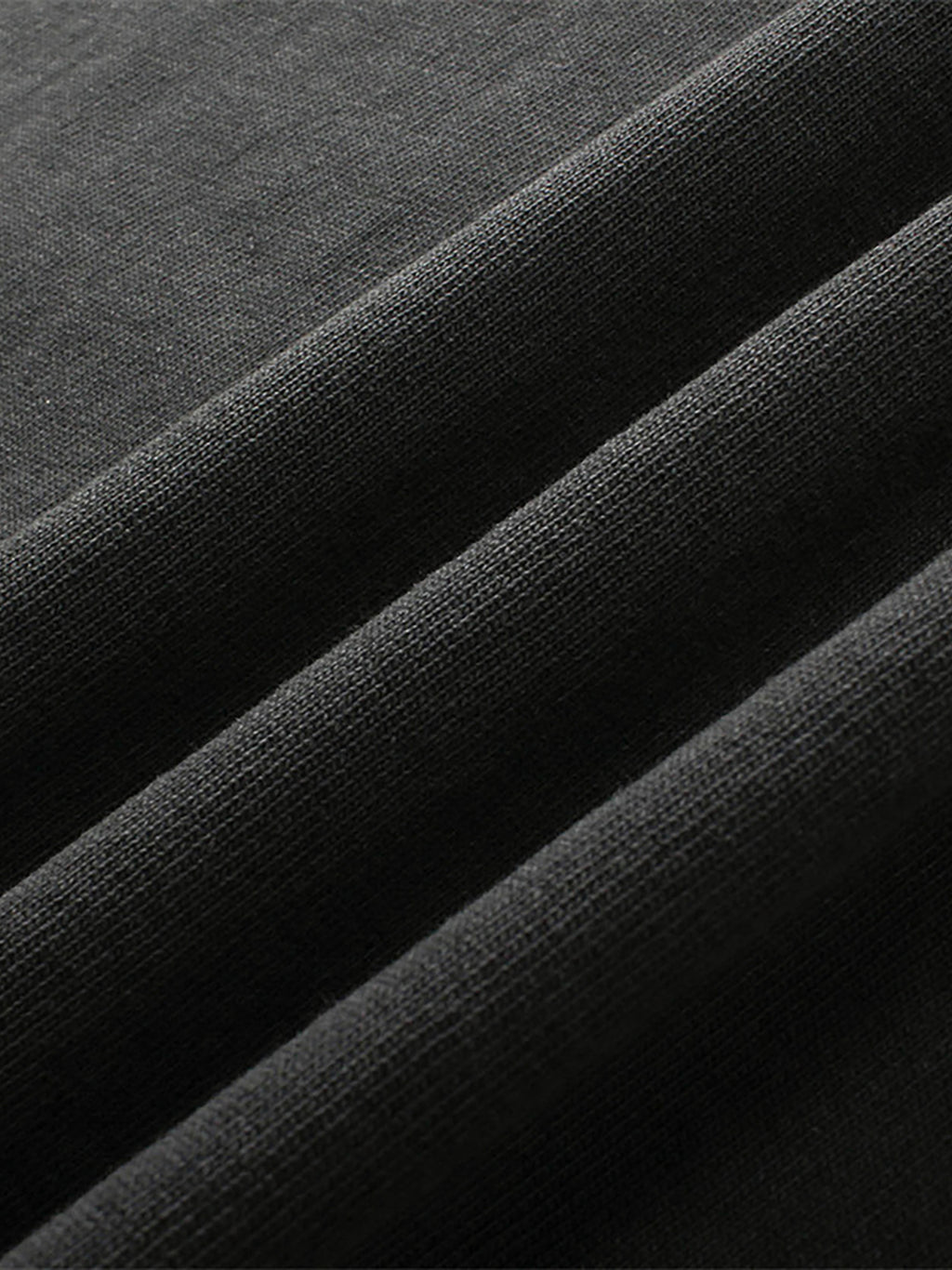 Close-up of black fabric with a textured pattern